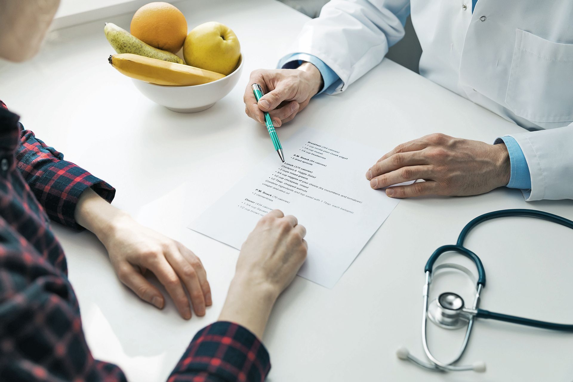 doctor with patient signing forms