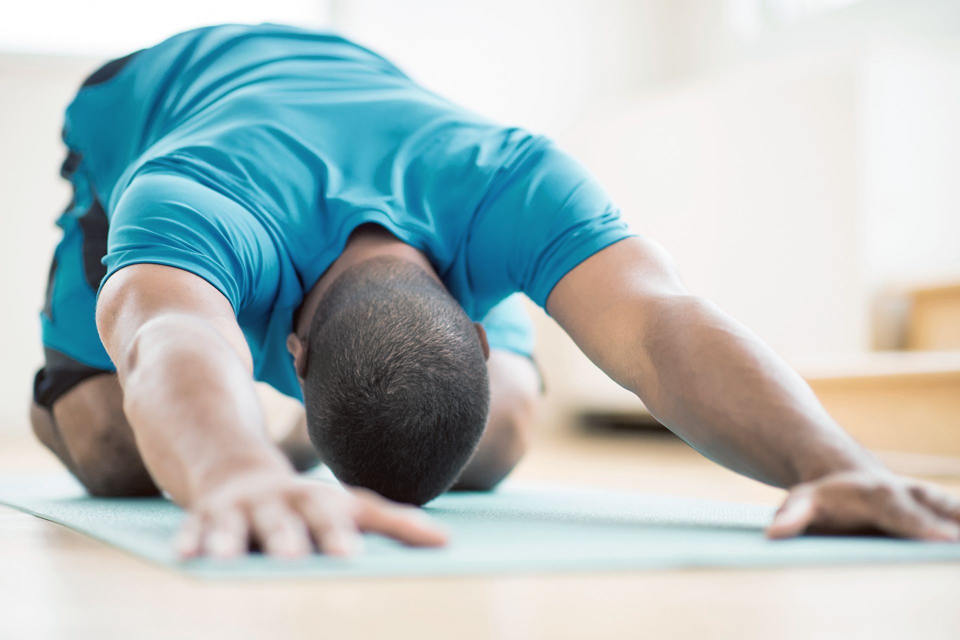 man doing yoga stretch