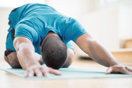 man doing yoga stretch