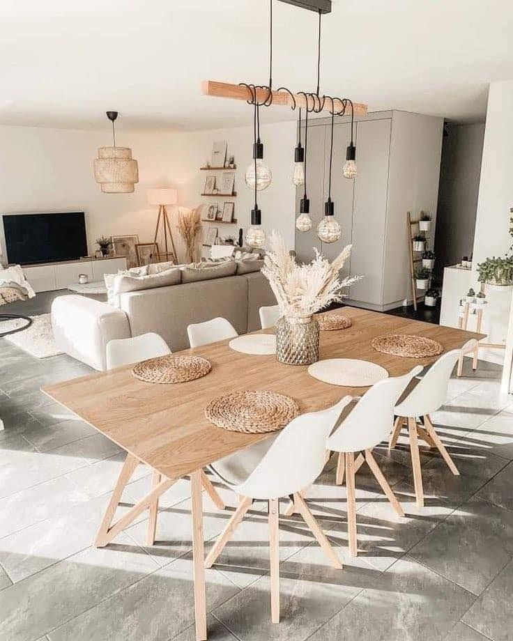 White fireplace with tile surround, artwork above, and dark gray hearth rug.