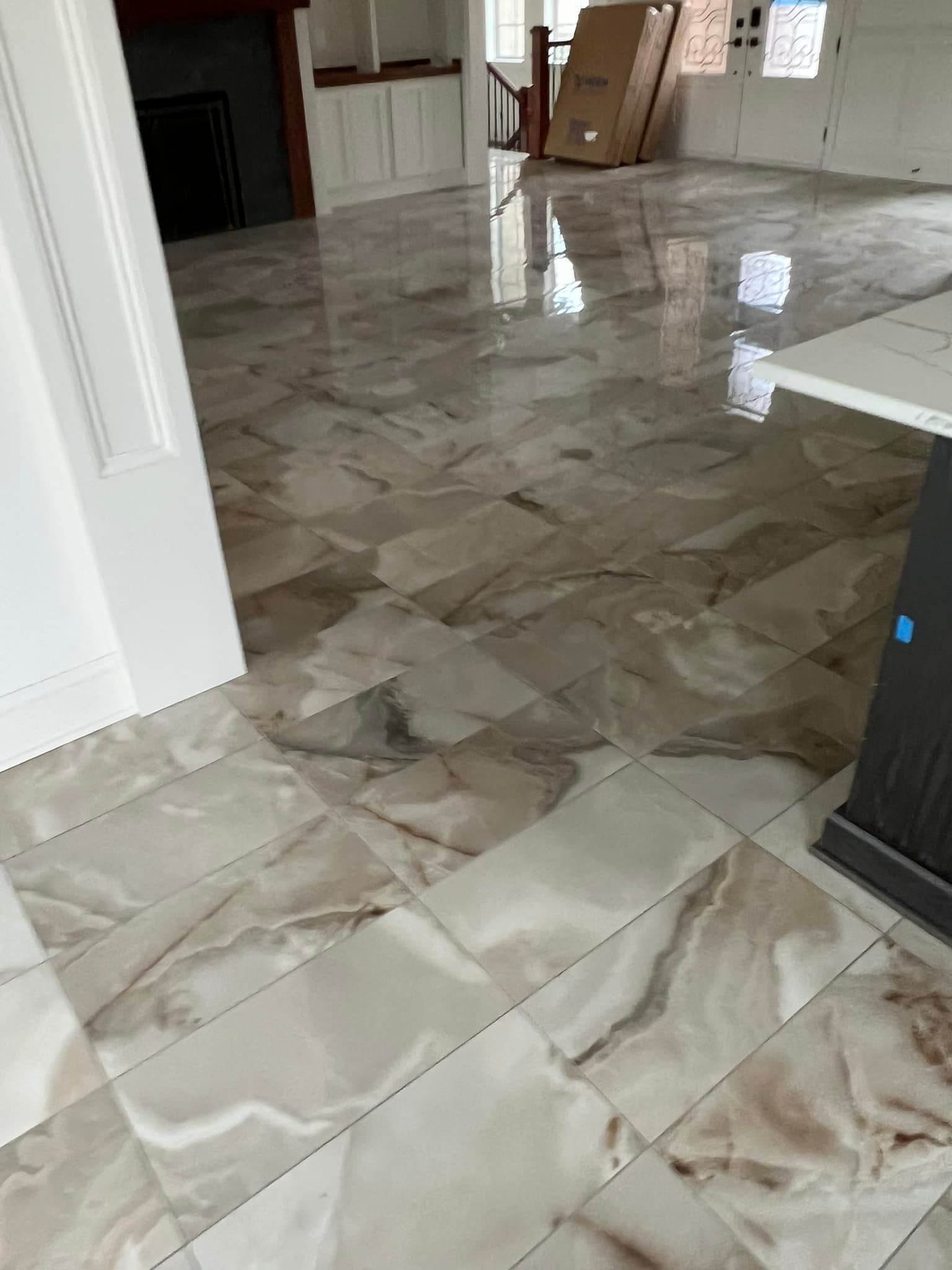 A living room with a marble floor and a table.