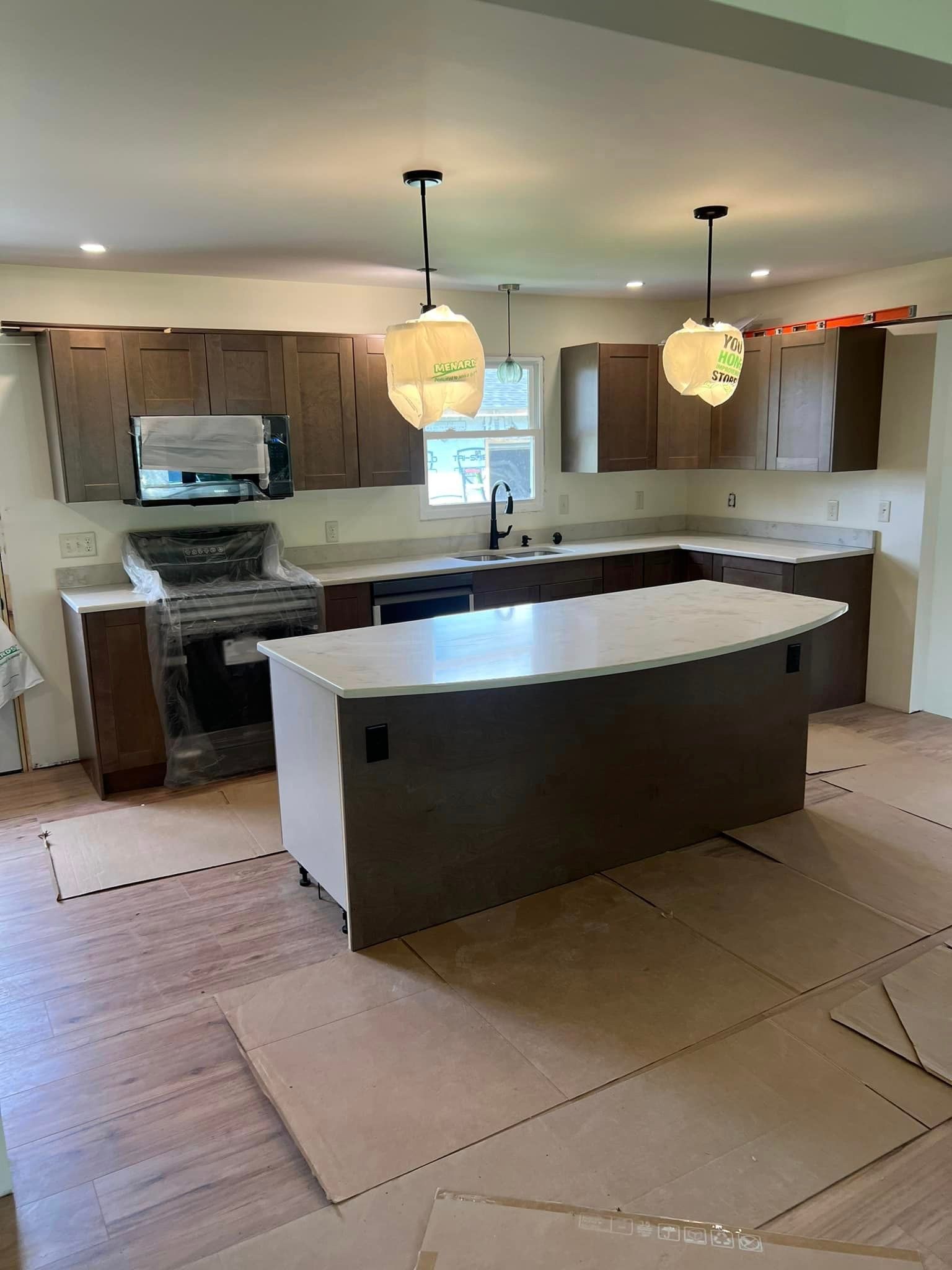 A kitchen with a large island in the middle of the room.
