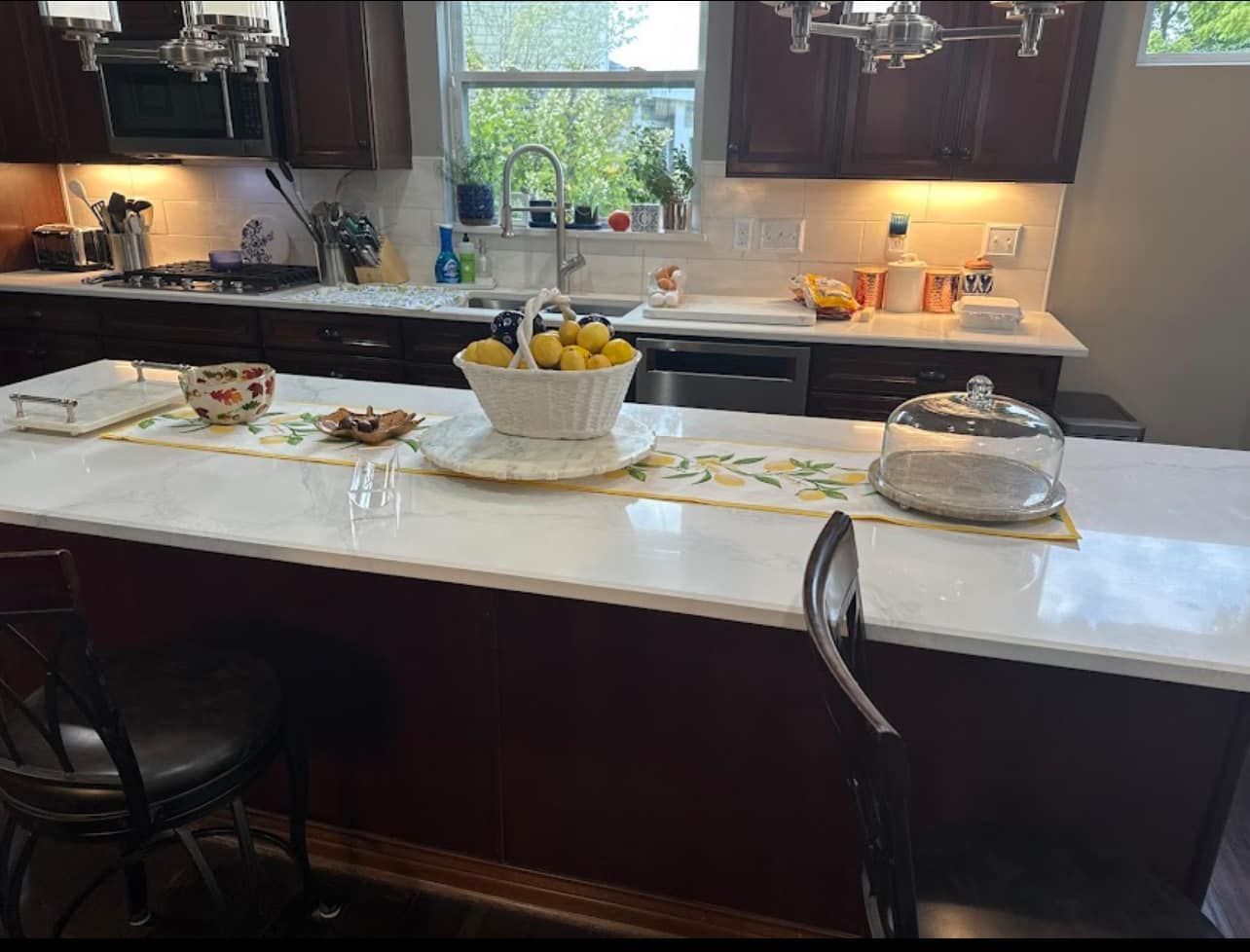 A kitchen with a bowl of lemons on the counter
