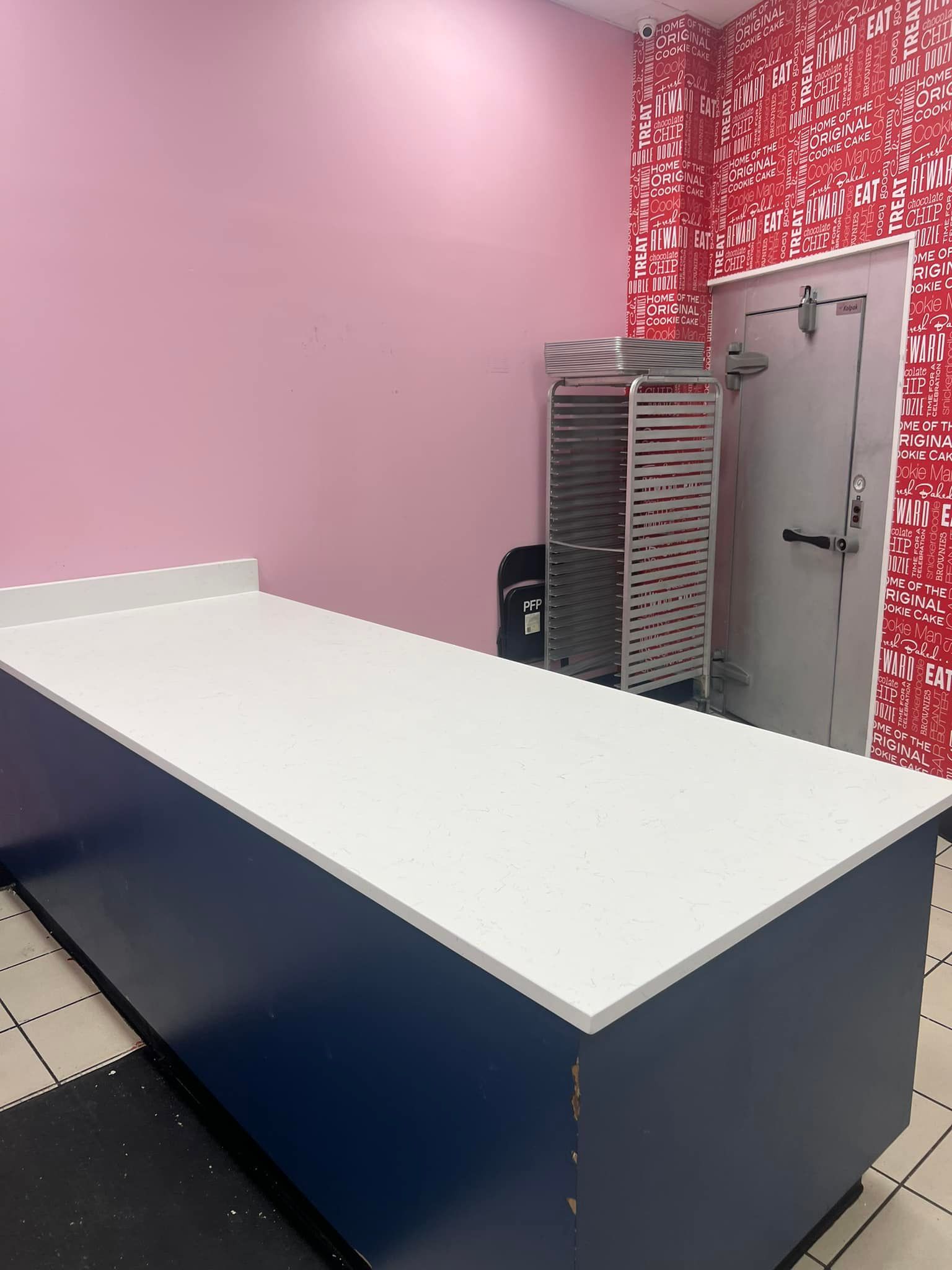 There is a large table in the middle of the room.