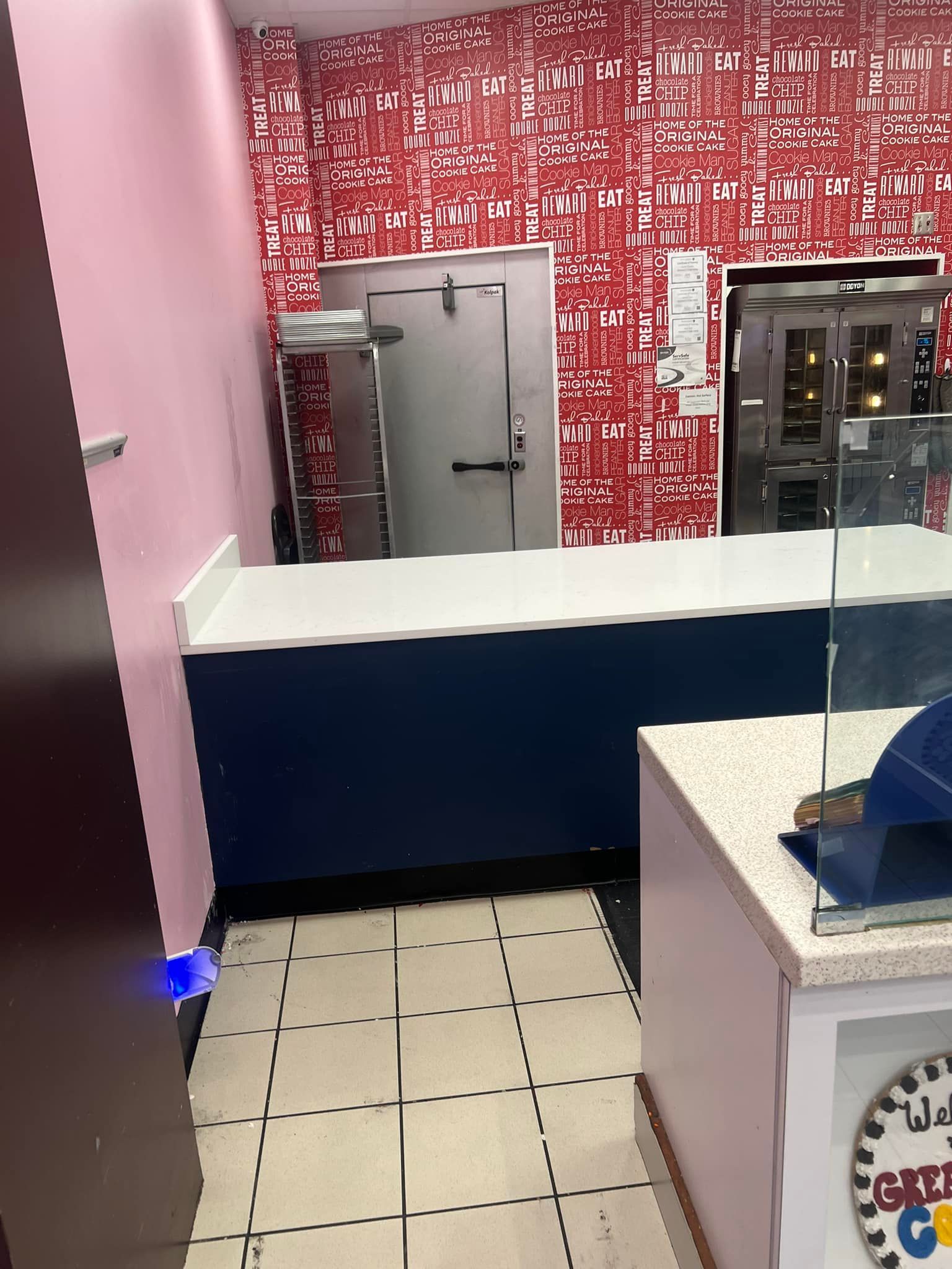 A room with a clock that says ' ice cream ' on it