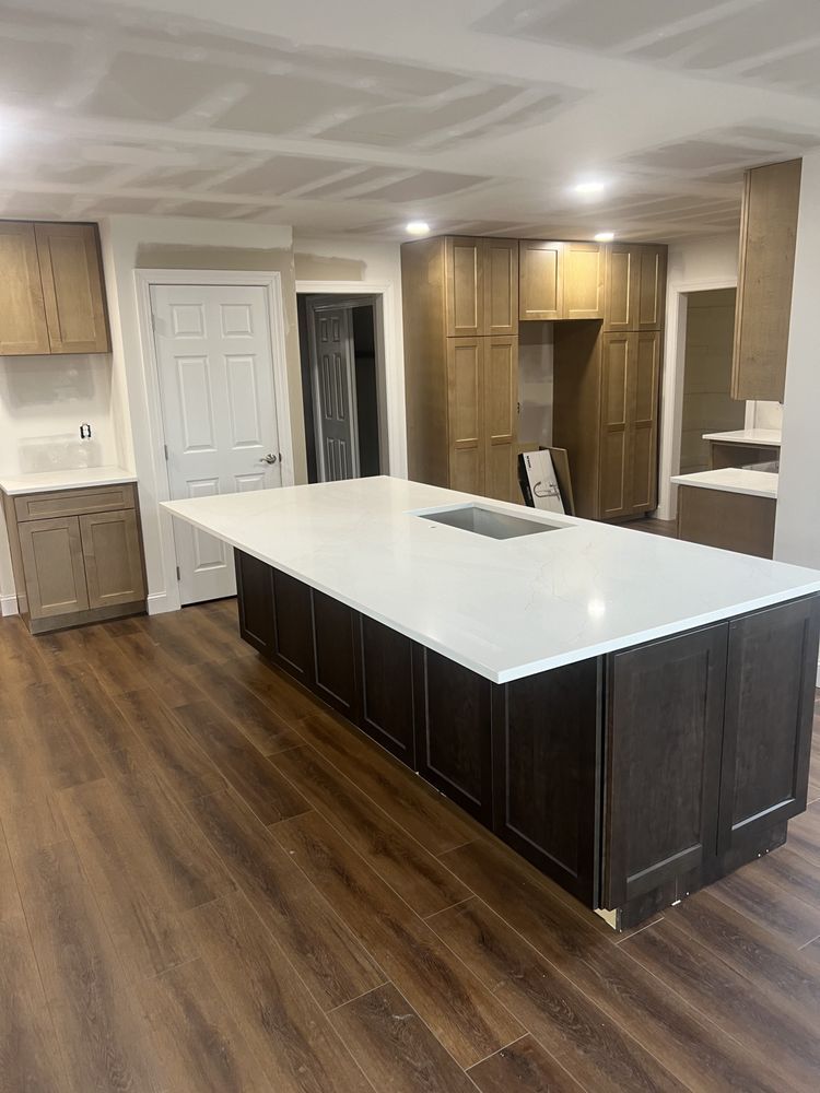 There is a large island in the middle of the kitchen.