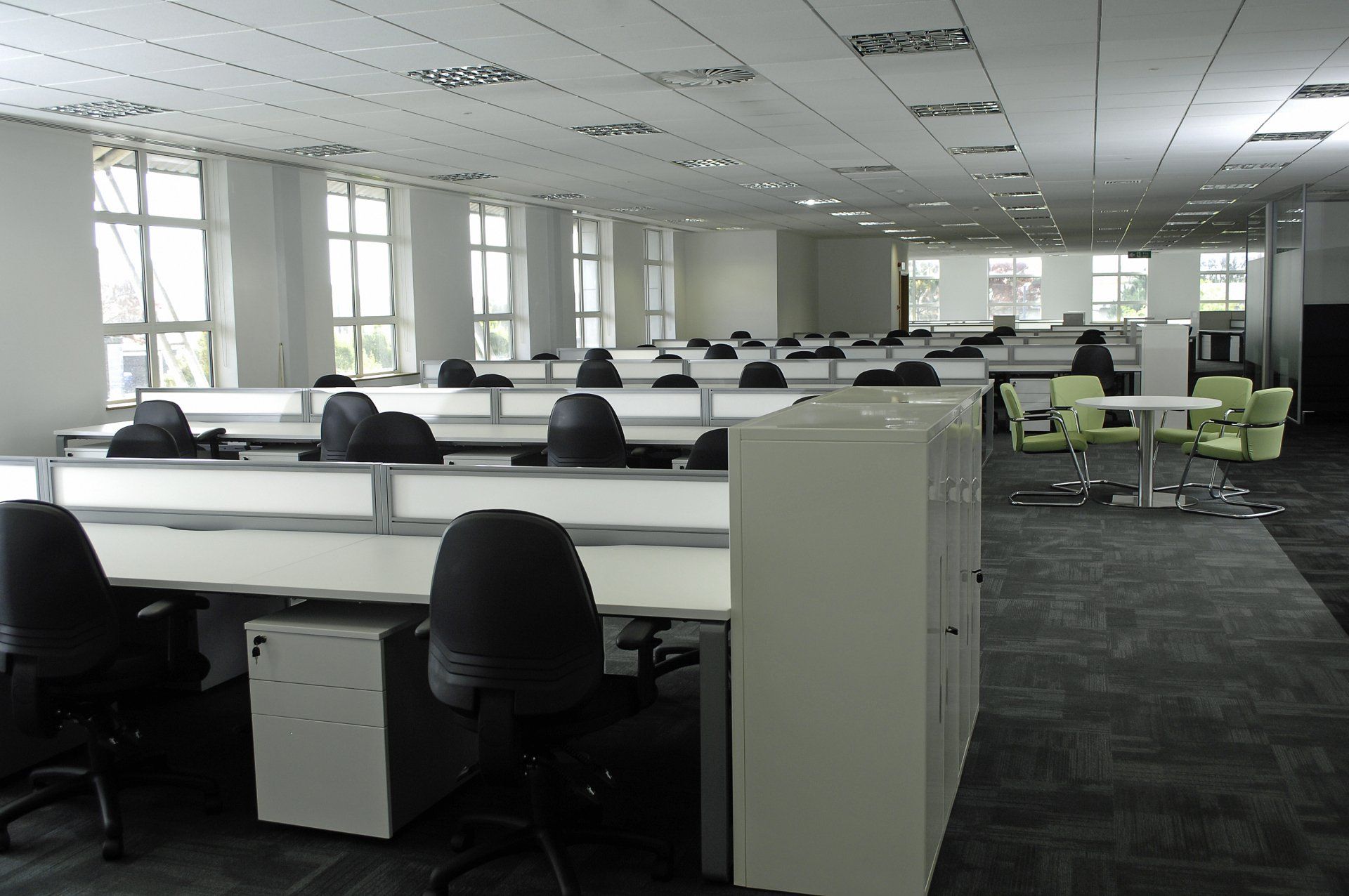 A large office with a lot of desks and chairs