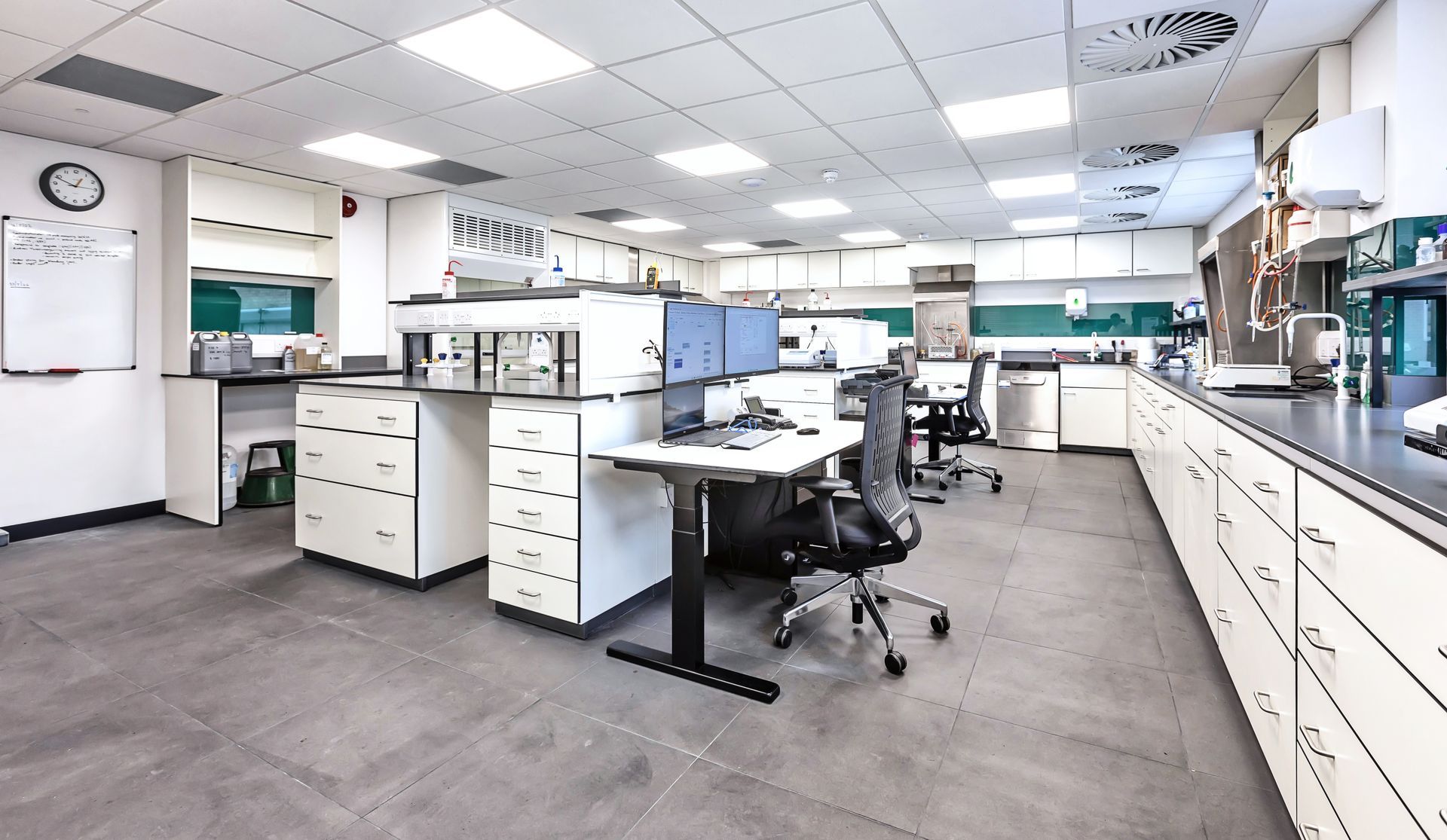 A laboratory with a lot of desks and chairs