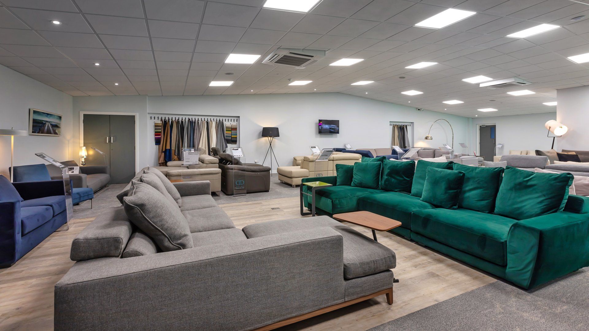 A large room filled with lots of couches and chairs.