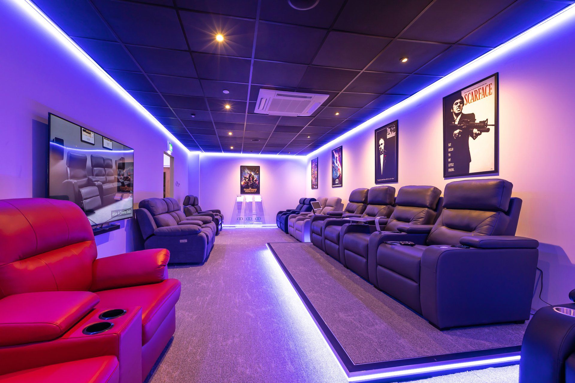 A large room with a lot of chairs and a television.