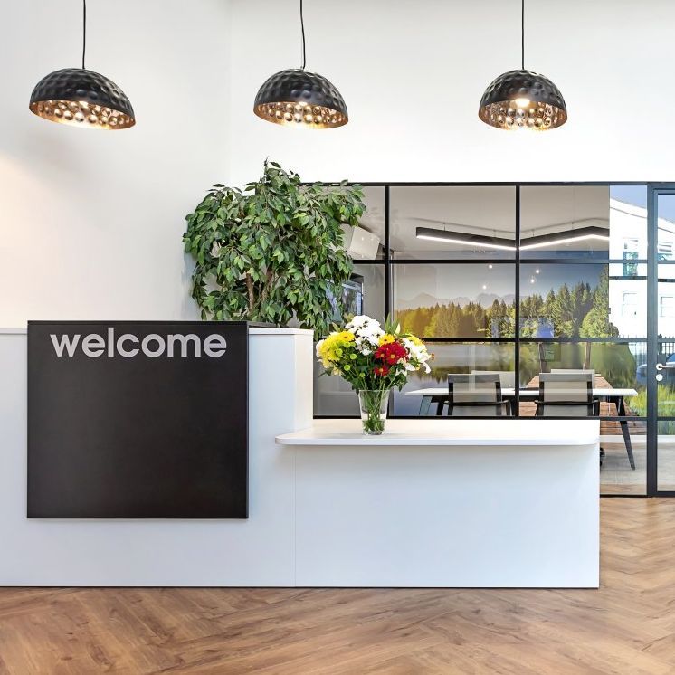 A reception area with a sign that says welcome