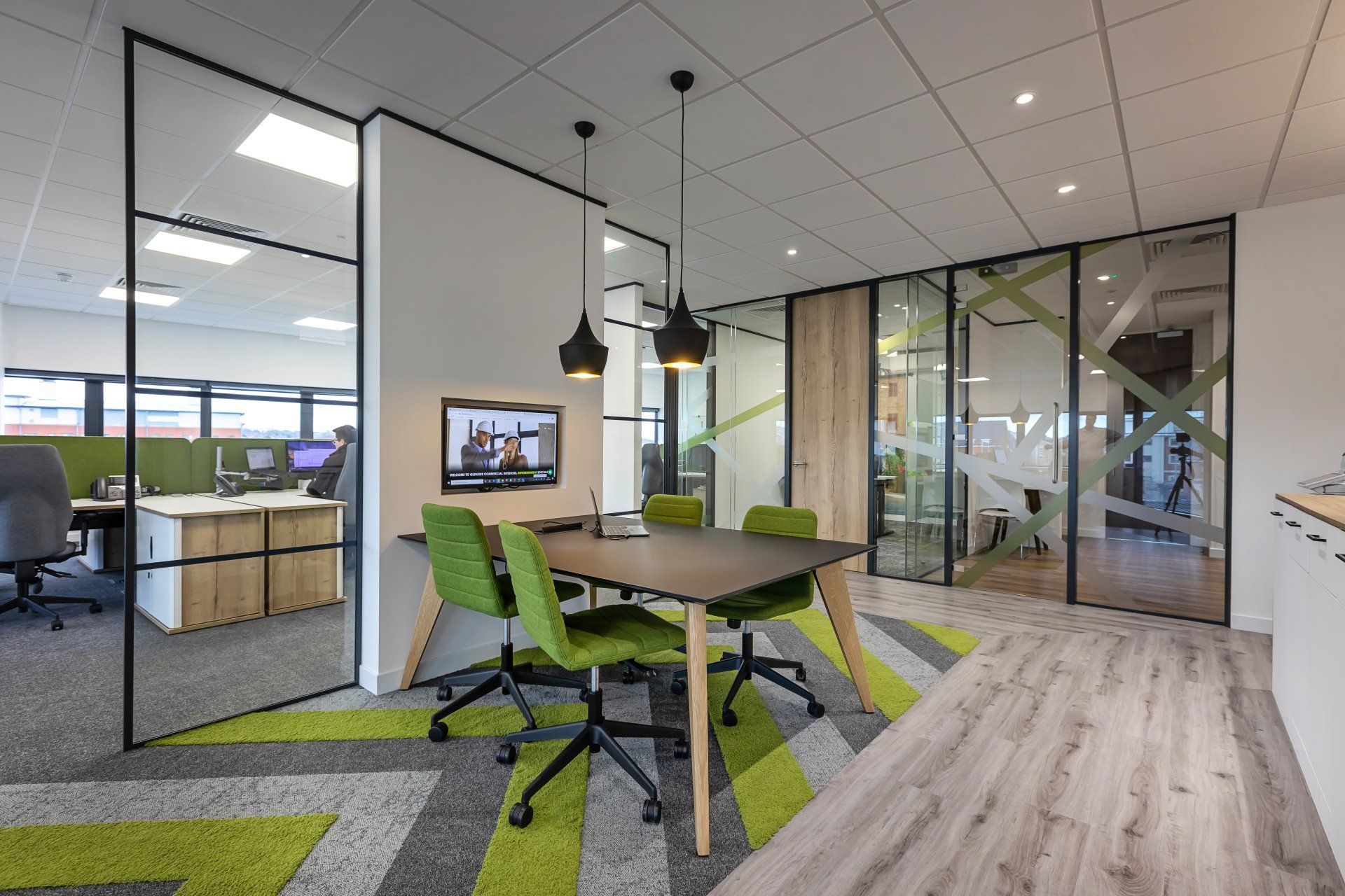 There is a table and chairs in the middle of the room.