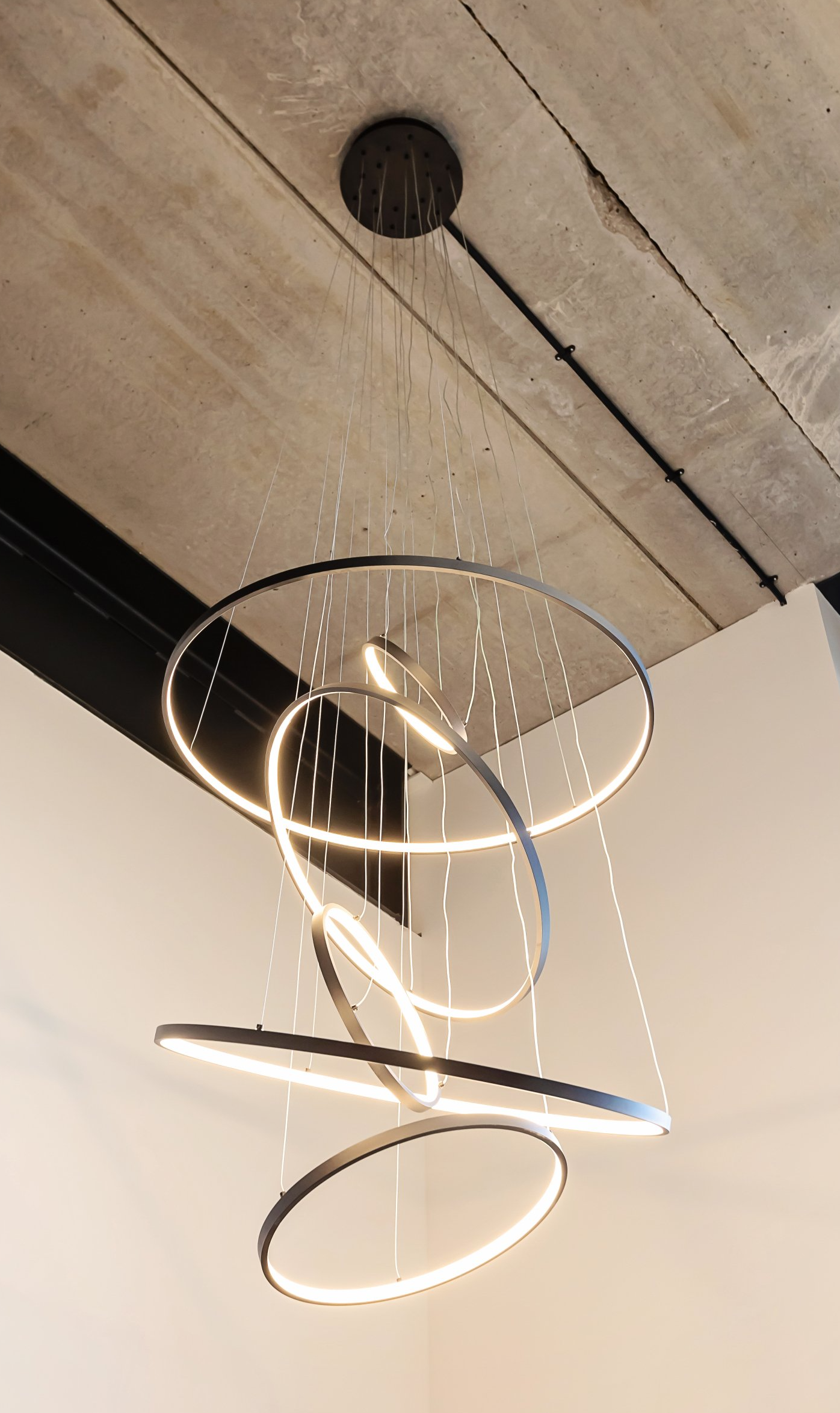 A circular light fixture is hanging from the ceiling