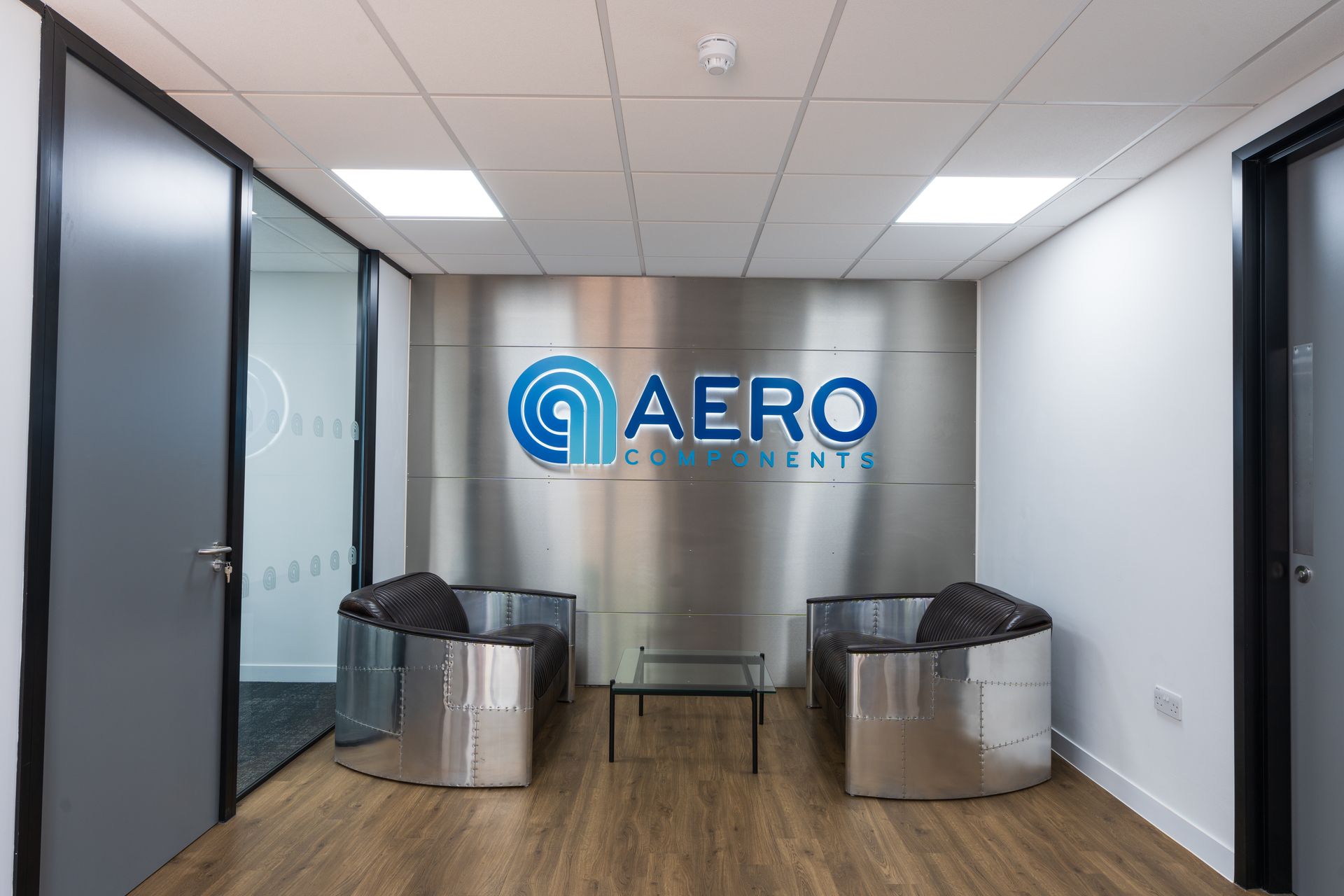A dressing room with a long table and chairs