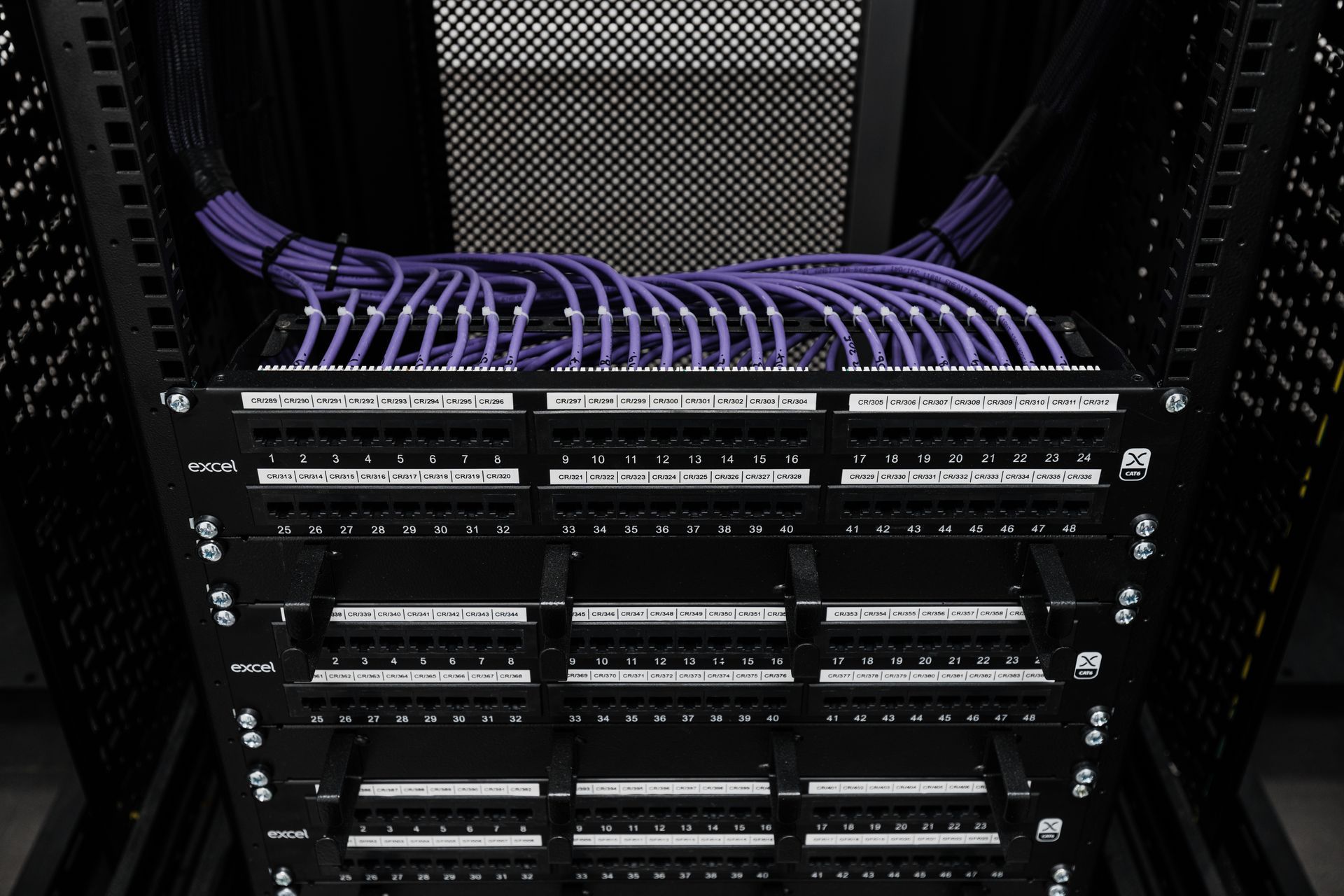A server rack with purple wires coming out of it