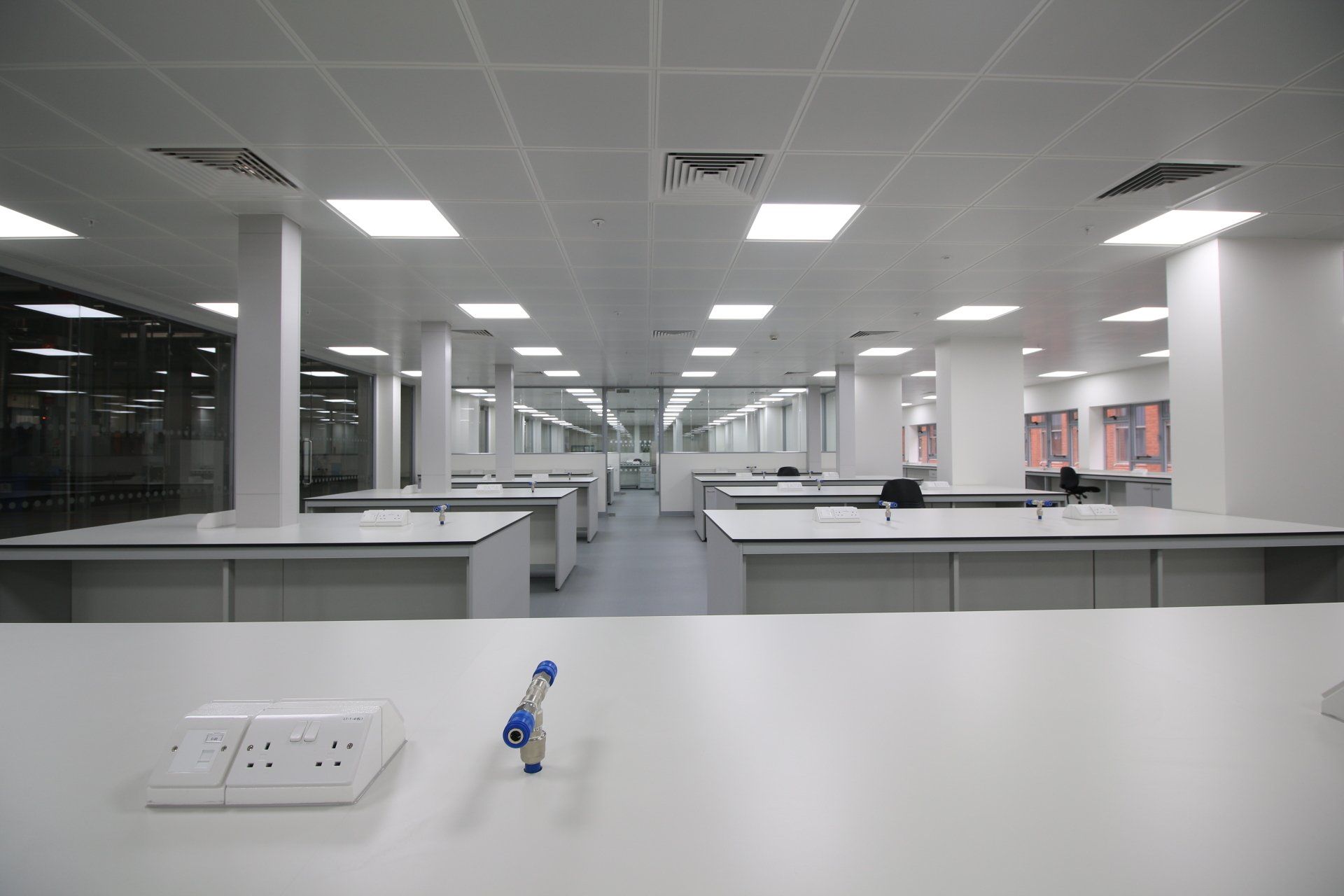 An empty laboratory with a blue marker on a table.