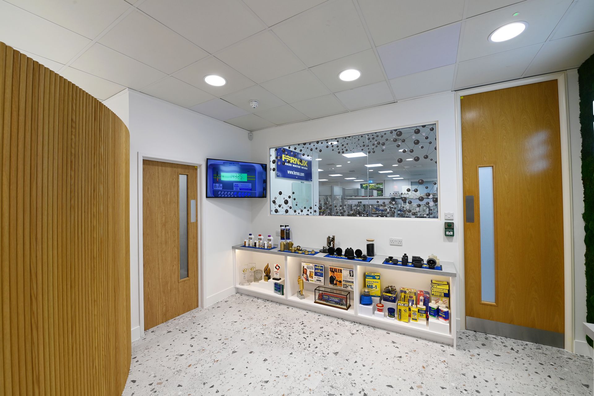 A recliner is sitting in a bedroom next to a nightstand and a lamp.