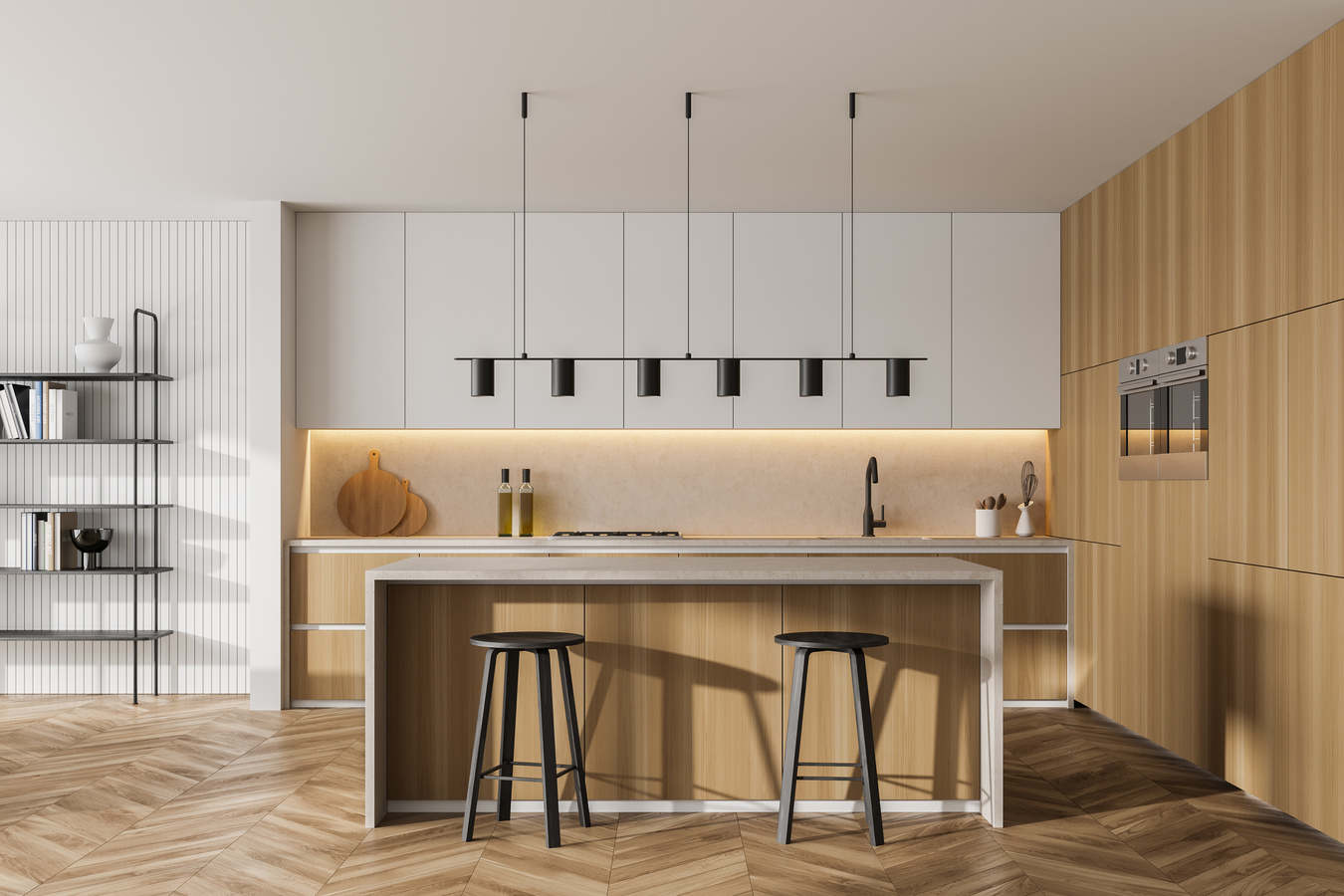 Modern kitchen with a wooden island, two stools, white cabinets, and a long pendant light on a herringbone wood floor.