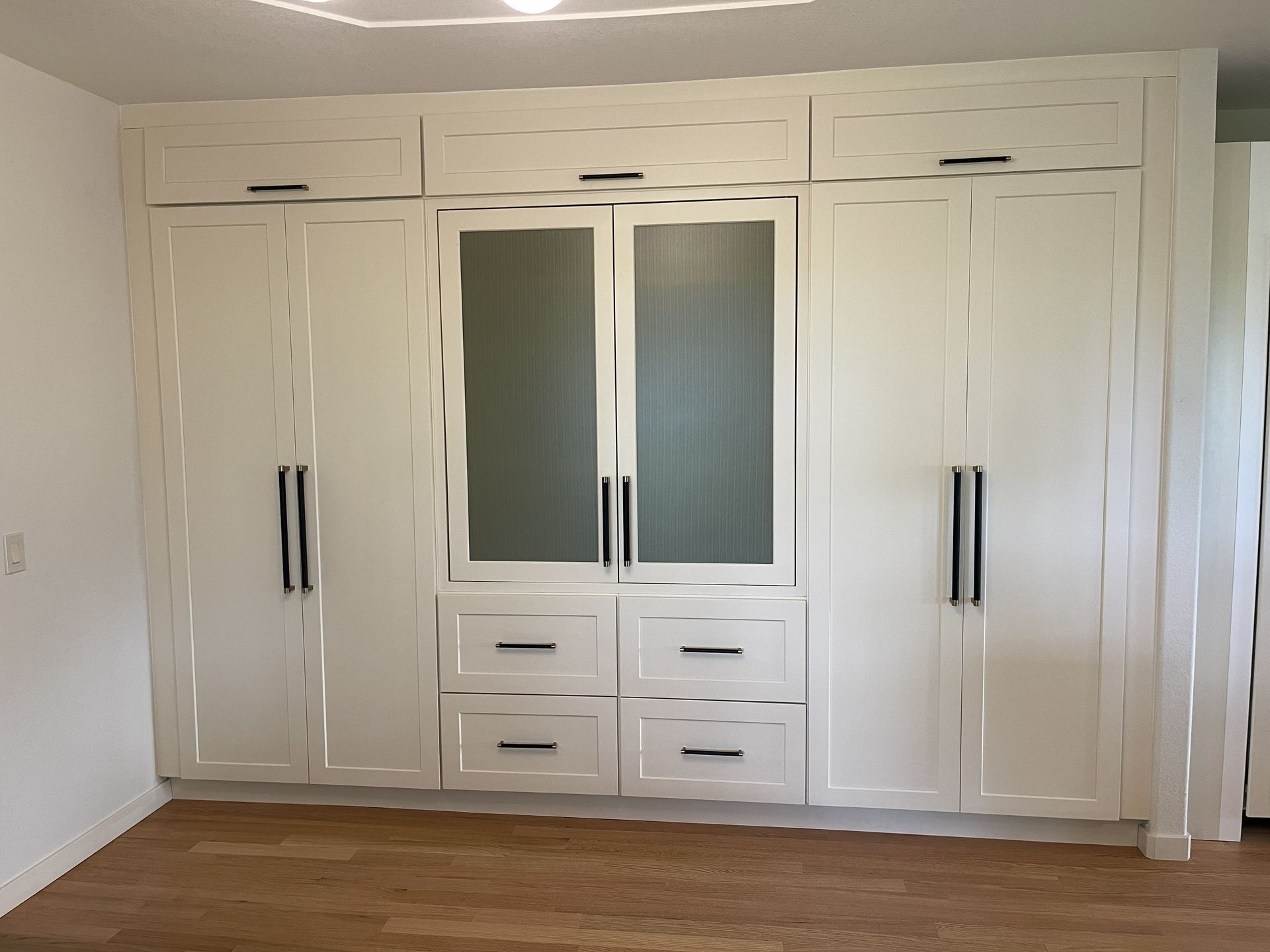 White storage closets and pantry built in Rocky Mountain Cabinets