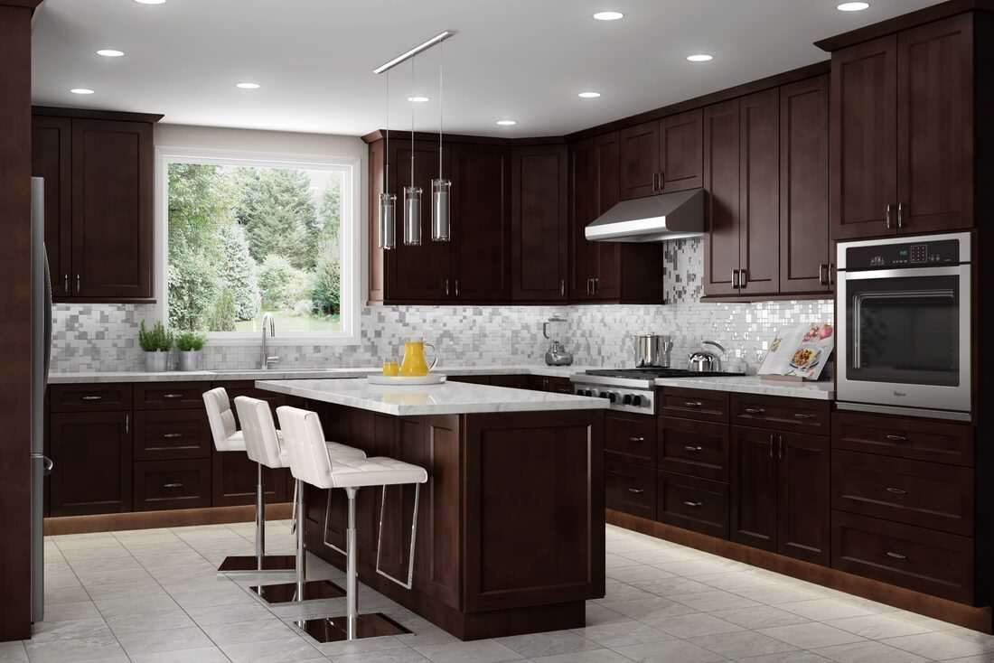 Modern kitchen with dark wood cabinetry, a white marble kitchen island with three stools, and stainless steel appliances.
