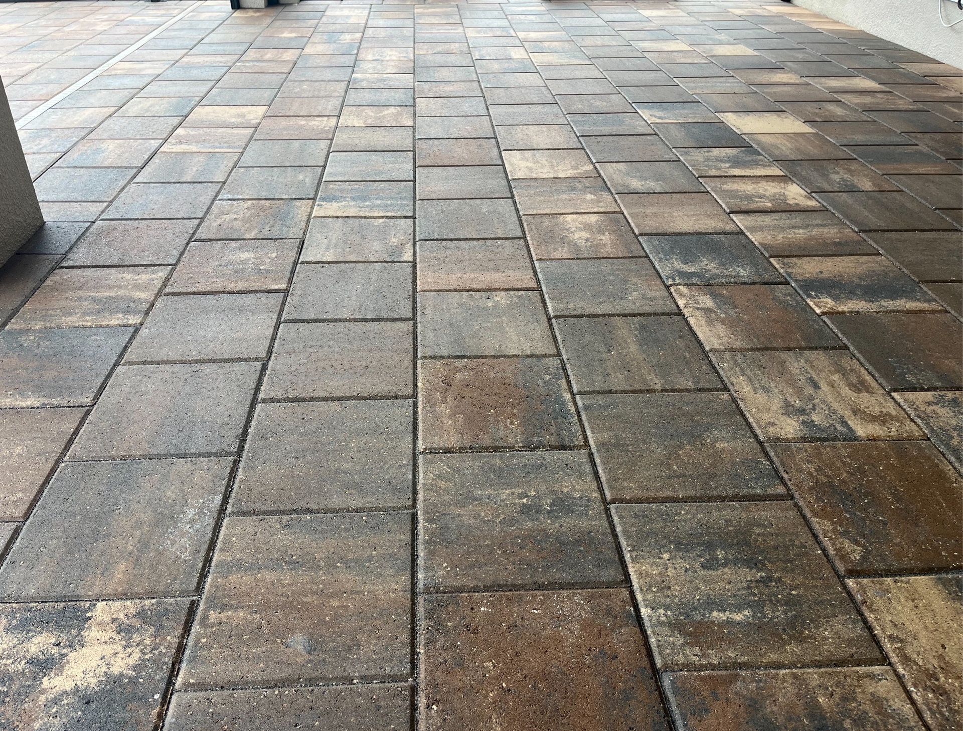  Outdoor patio showcasing paver cleaning services near you, with sealed and refreshed pavers.