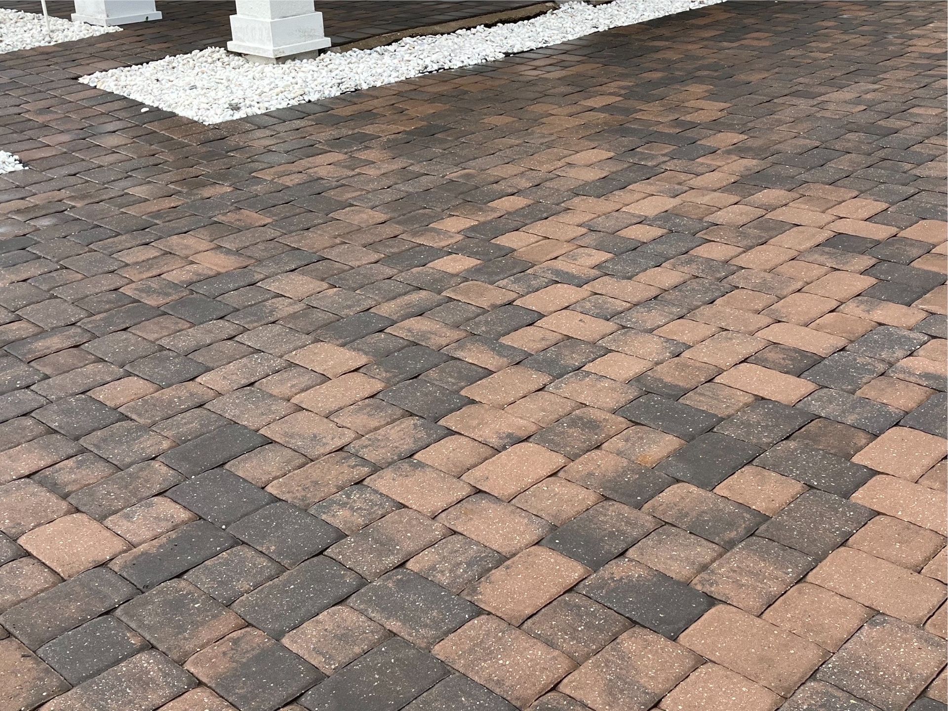 Freshly sealed paver driveway with enhanced color and protection, showcasing paver sealing services.