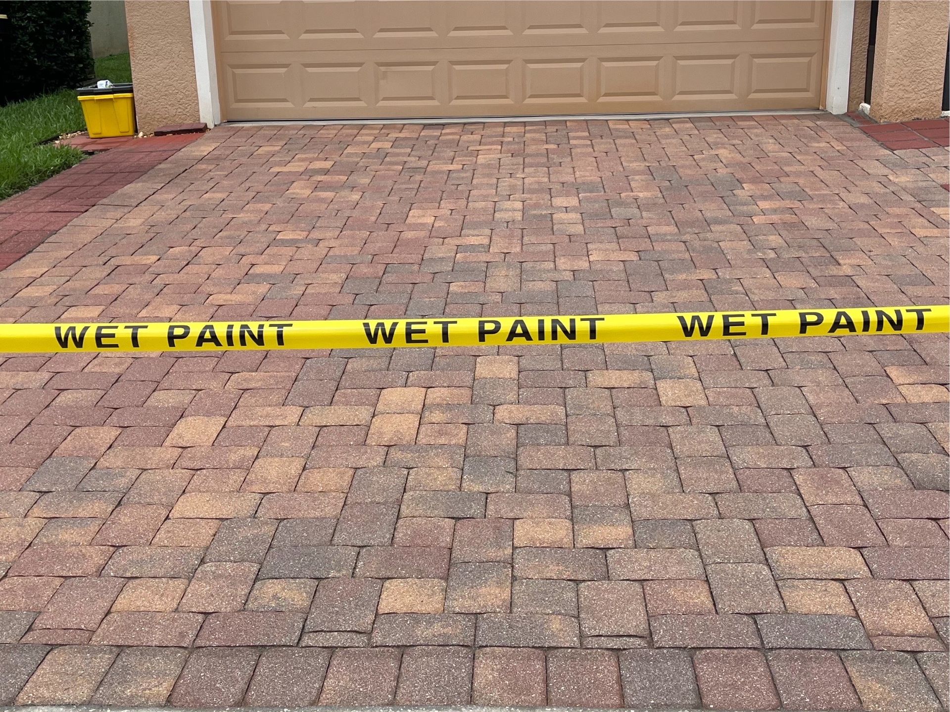 Power washing in action, removing dirt and grime from a brick driveway with pressure washing services near you.