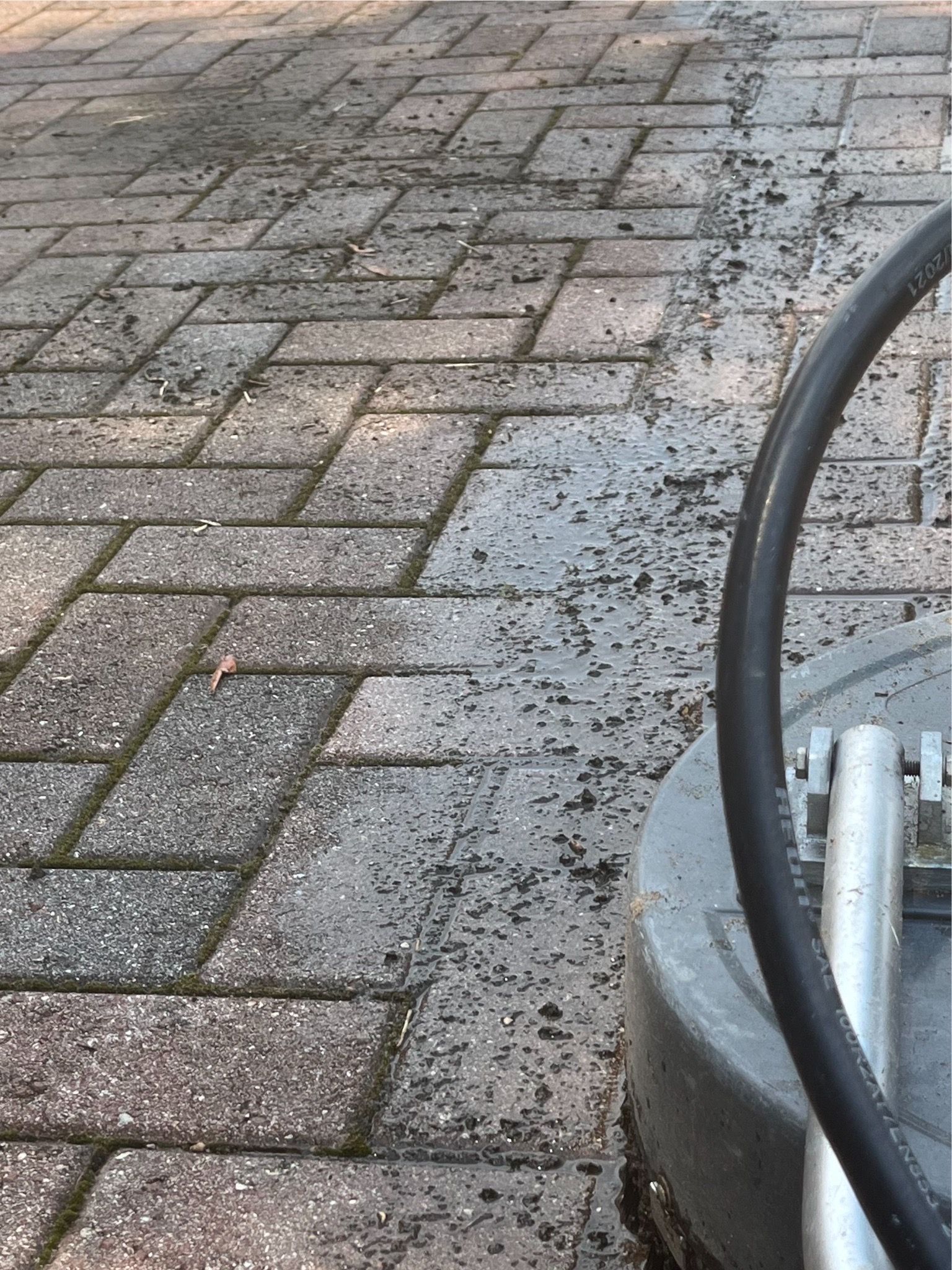 Before-and-after comparison of paver cleaning services, restoring vibrancy and cleanliness.