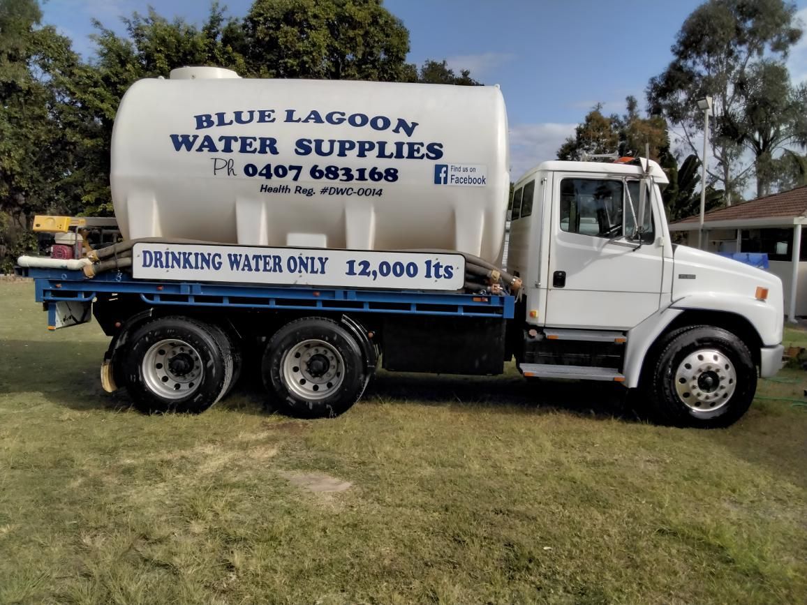 A Blue Lagoon Water Supplies Truck Is Parked In The Grass — Blue Lagoon Water Supplies In Fraser Coast, QLD