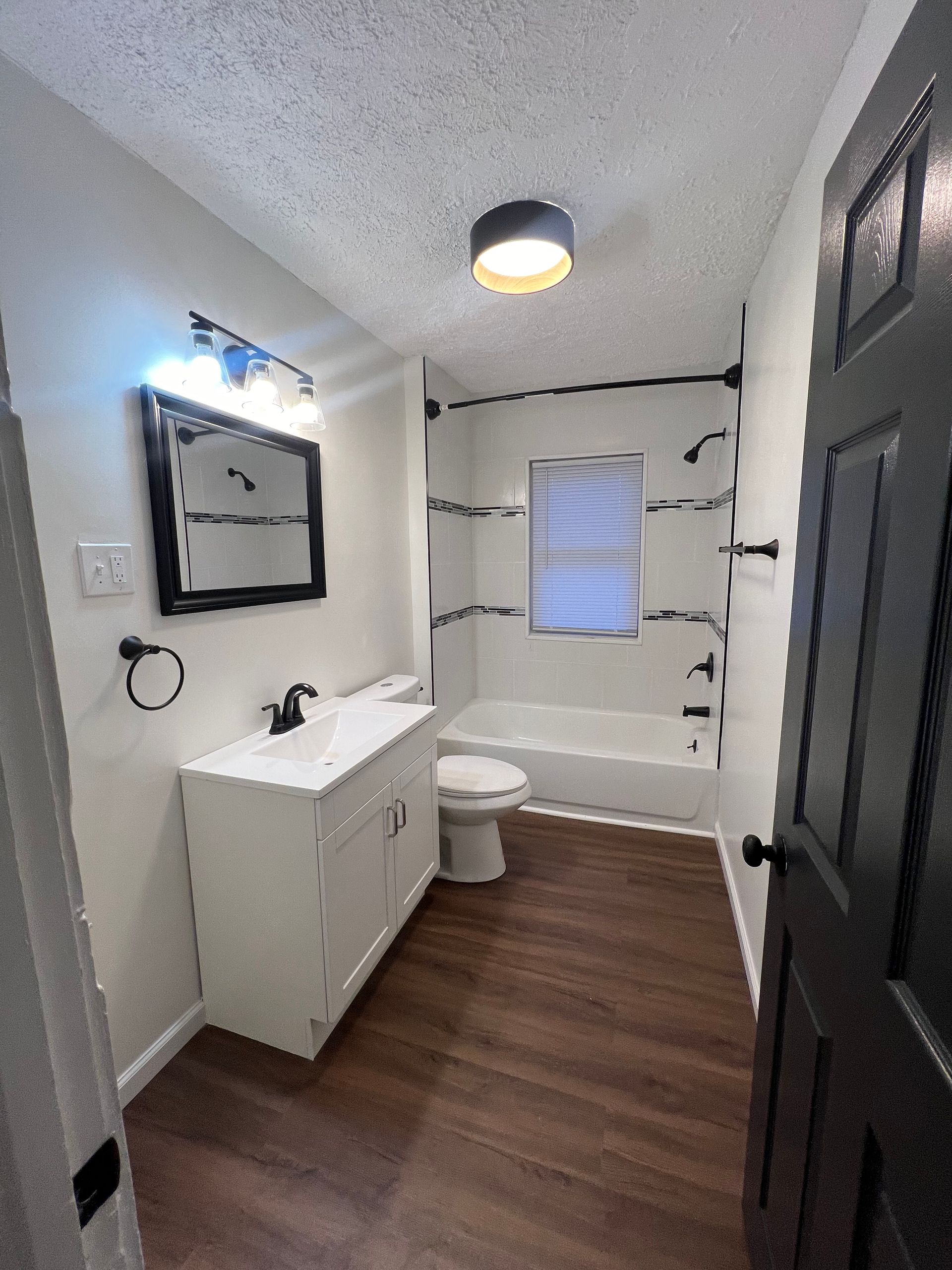 A bathroom with two sinks and two mirrors.