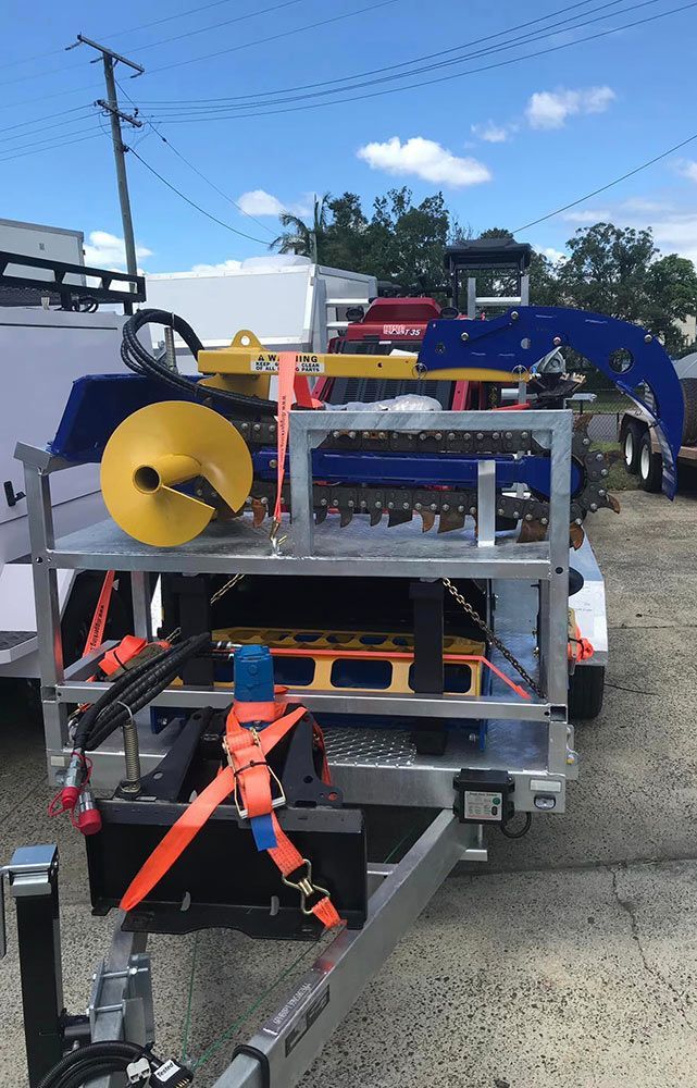 A Trailer With a Machine on It is Parked in a Parking Lot — S & S Tiling and Rendering in Geurie, NSW