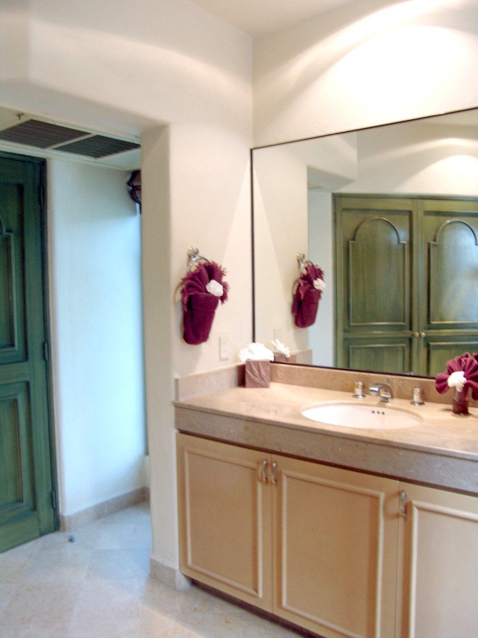 a bathroom with a sink and a large mirror