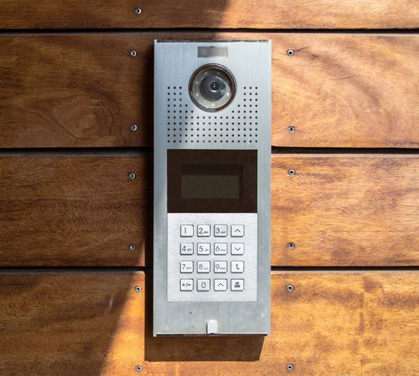 A Doorbell Is Mounted on A Wooden Wall — T.N. Locke Communications In Alligator Creek, QLD