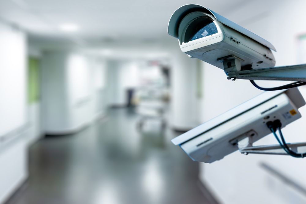 Two Security Cameras Are Sitting in A Hallway in A Hospital — T.N. Locke Communications In Kirwan, QLD
