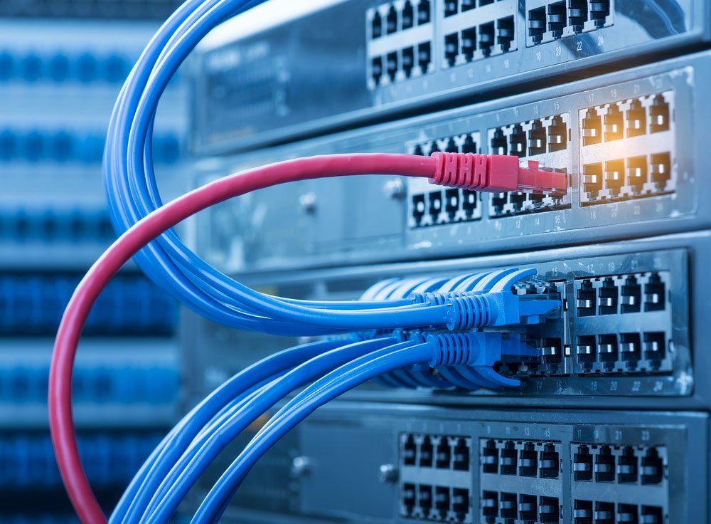 A Bunch of Wires Are Connected to A Server in A Server Room — T.N. Locke Communications In Kirwan, QLD