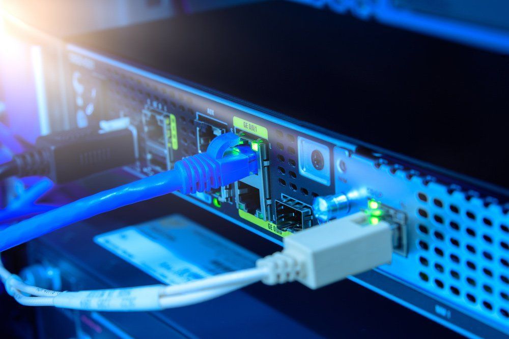 A Close up Of a Computer with A Cable Plugged Into It — T.N. Locke Communications In Kirwan, QLD