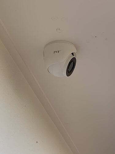 A Security Camera Is Mounted to The Ceiling of A Room — T.N. Locke Communications In Kirwan, QLD