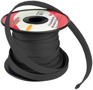A spool of black braided ribbon on a white background