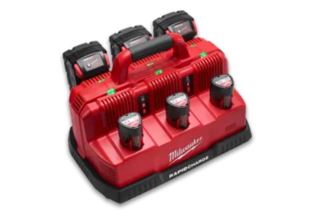 A red milwaukee charger with three batteries on it