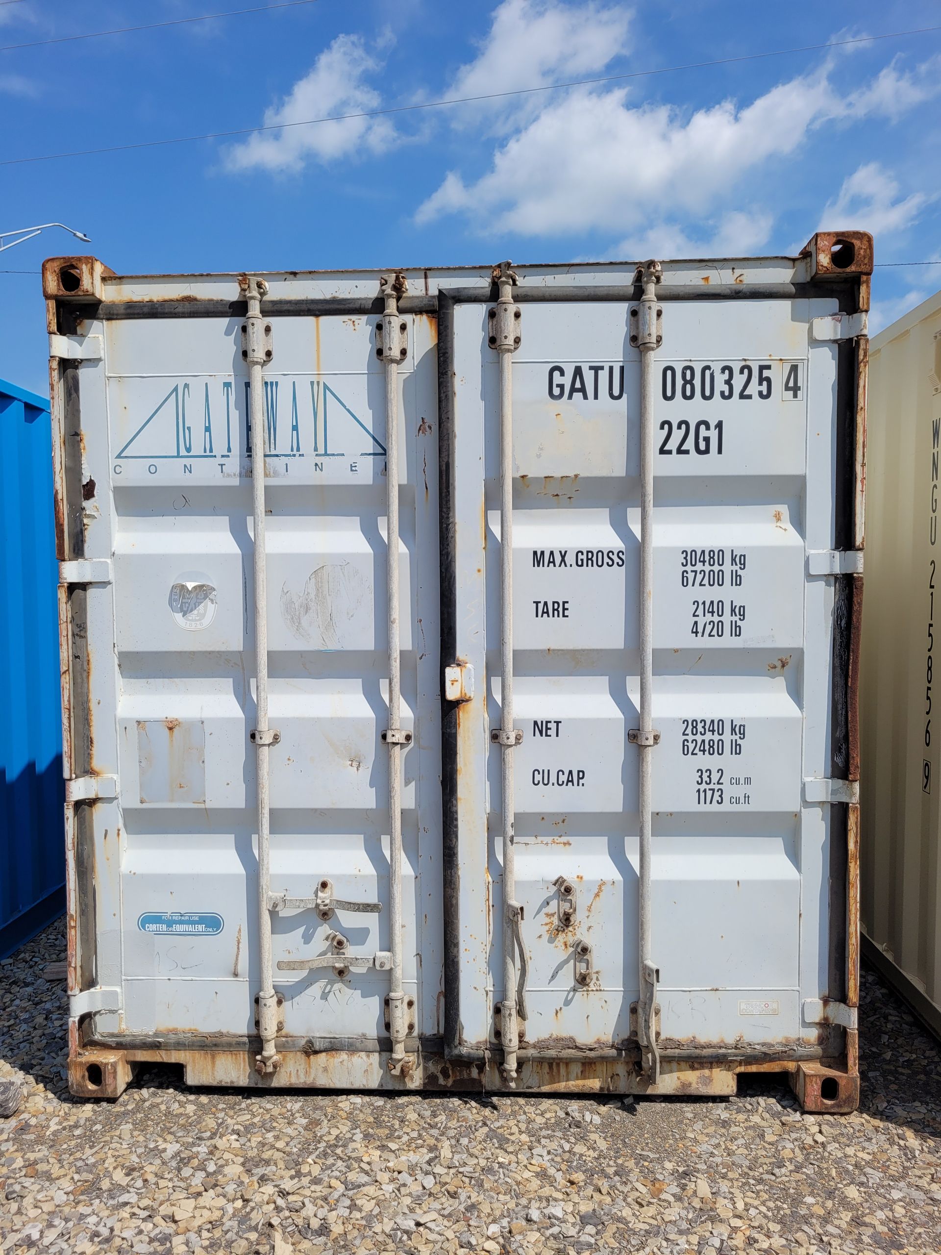 A white shipping container with the number 2261 on it