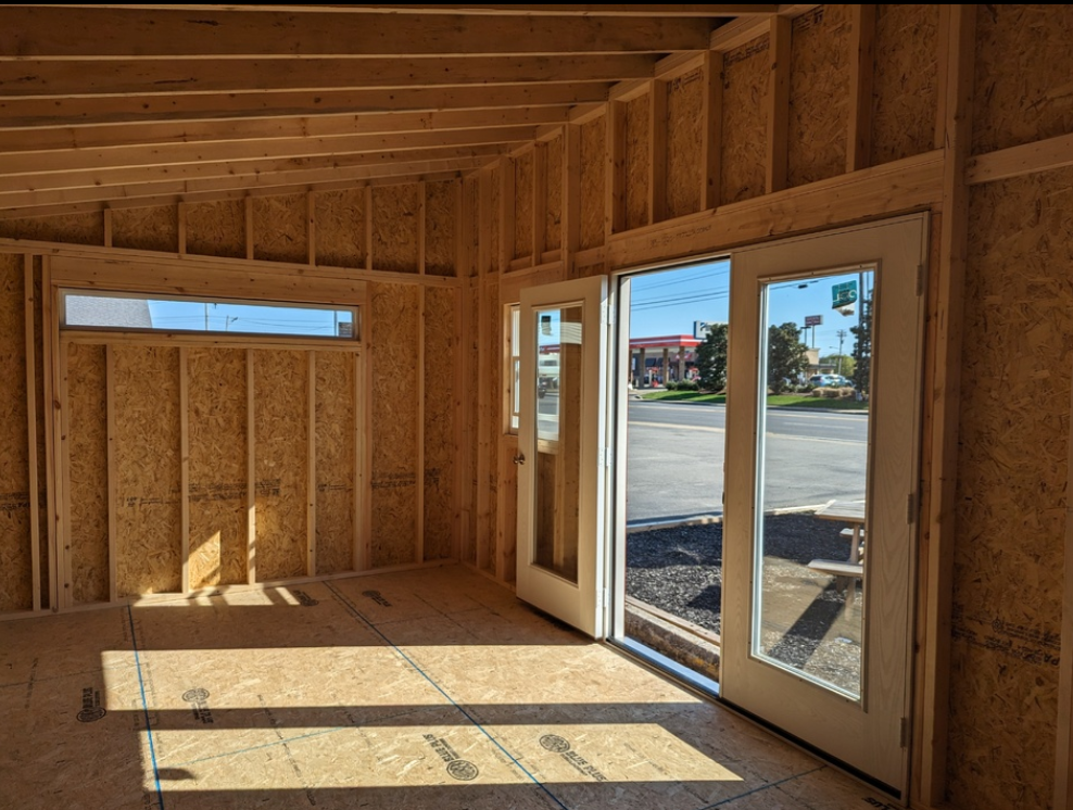 A room with a lot of windows and doors in it