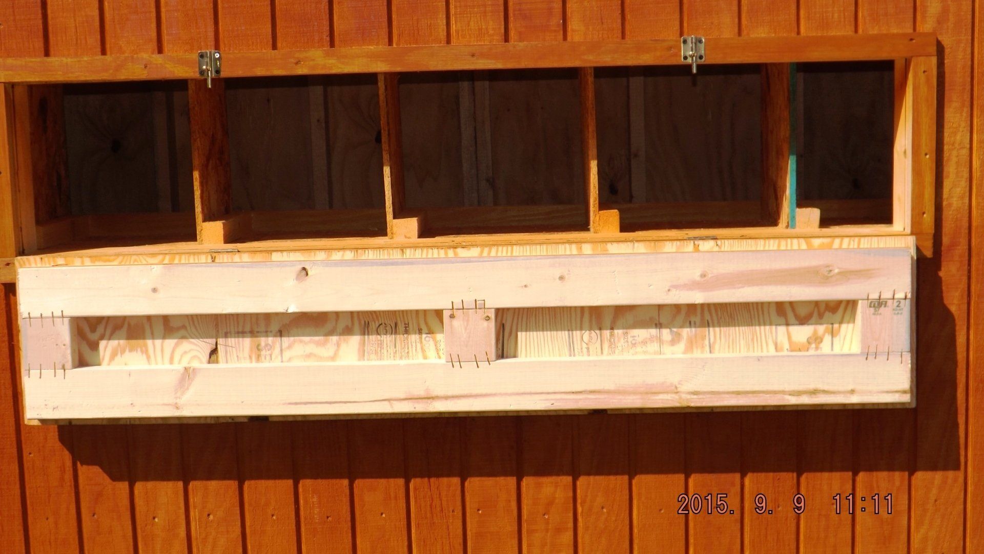 A picture of a wooden shelf was taken on april 9th 2011