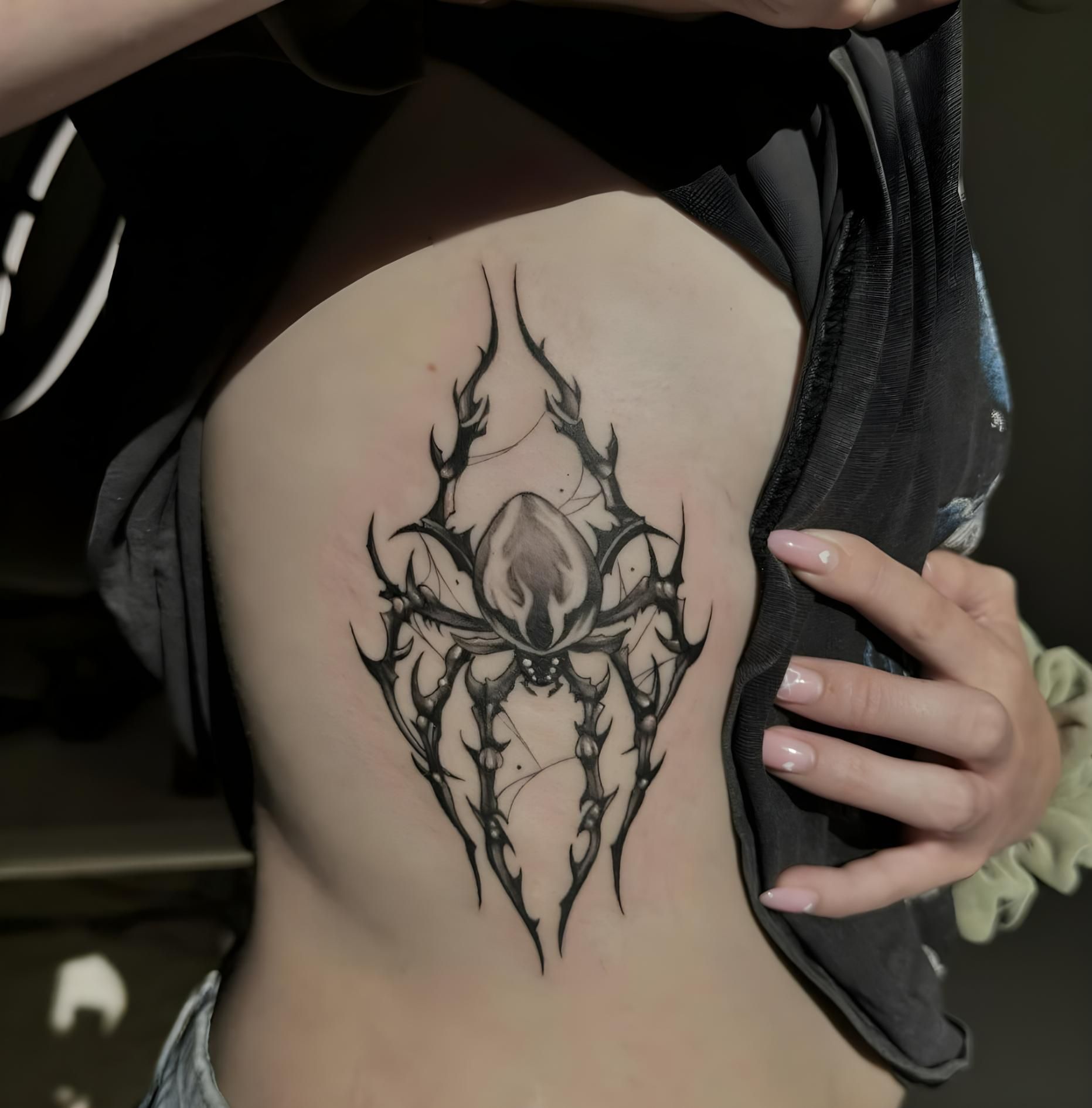Tattoo Of A Spider-like Design On A Person's Side — Tattoo Inc Studio In Broadbeach, QLD