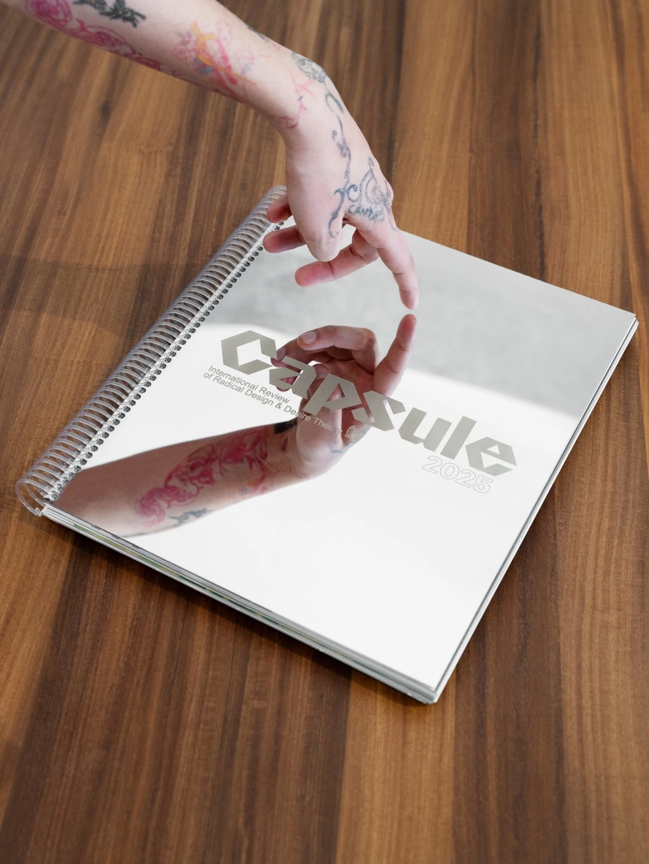 Tattoo artist's gloved hand dips the needle an ink container with other ink containers next to it — Tattoo Inc Studio In Broadbeach, QLD