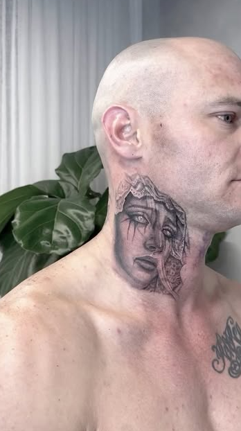 Man With A Shaved Head And A Tattoo Of A Face On His Neck — Tattoo Inc Studio In Broadbeach, QLD
