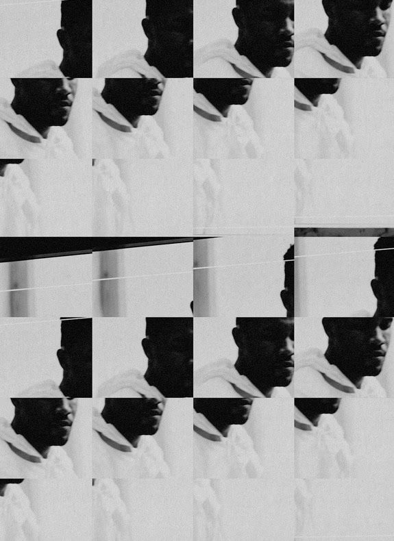 White outline of a tattoo machine on a dark fabric background within a transparent circle.