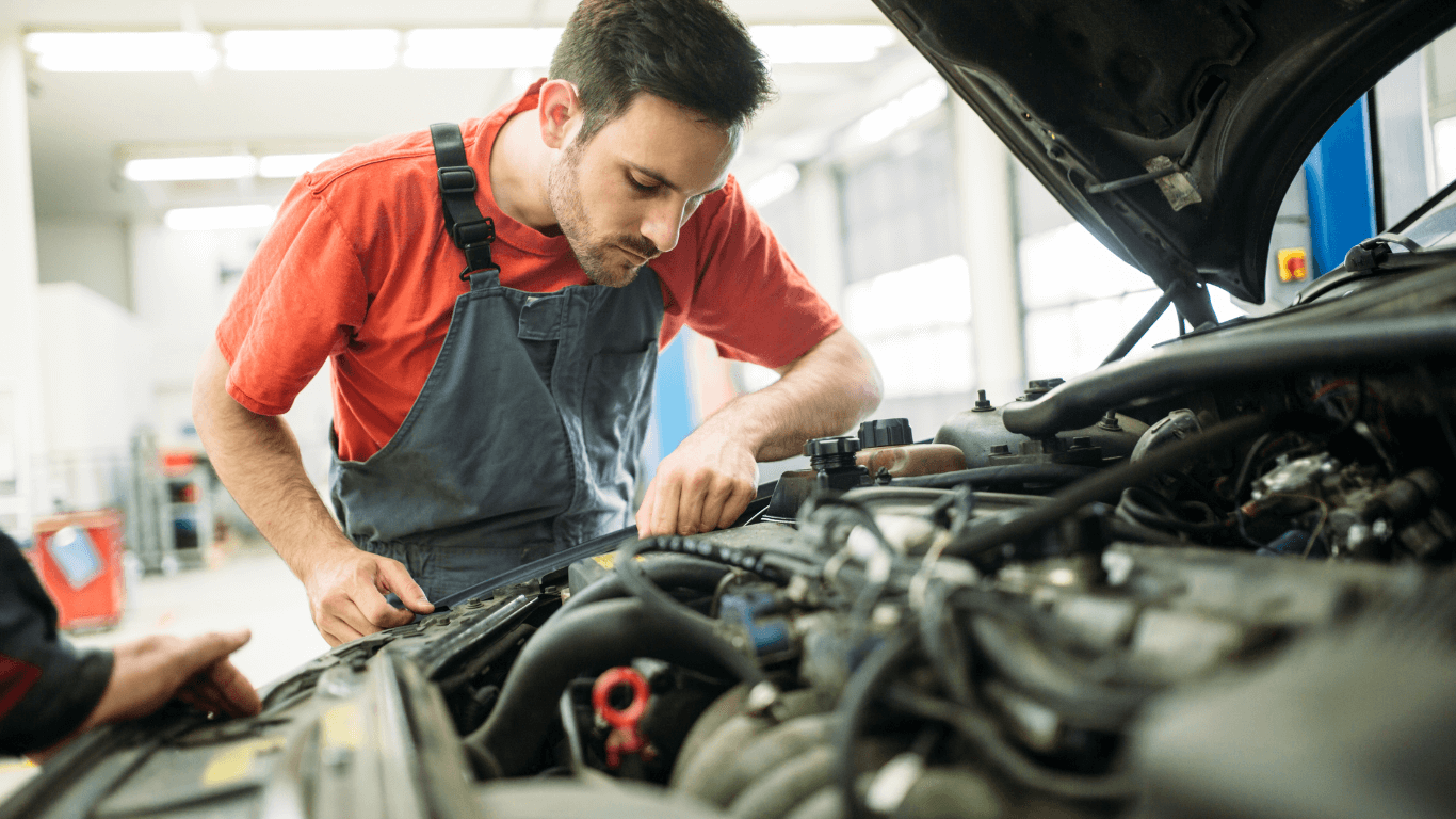 mechanic under hood of a car in Kansas City