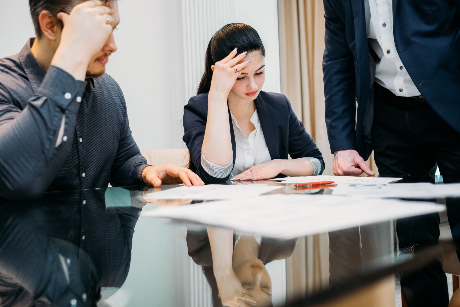 A man and woman sitting at a family lawyer's office.