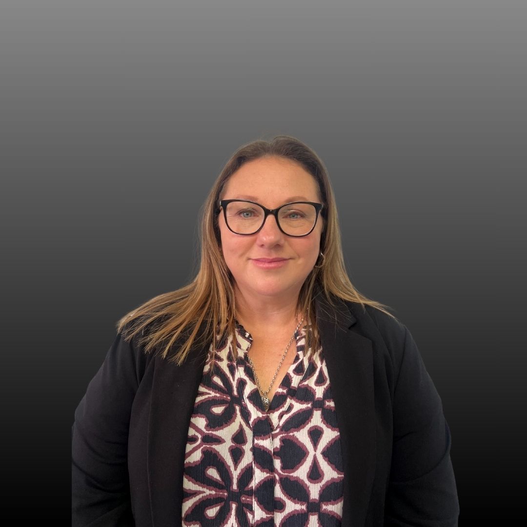 A person is holding a last will and testament in their hands