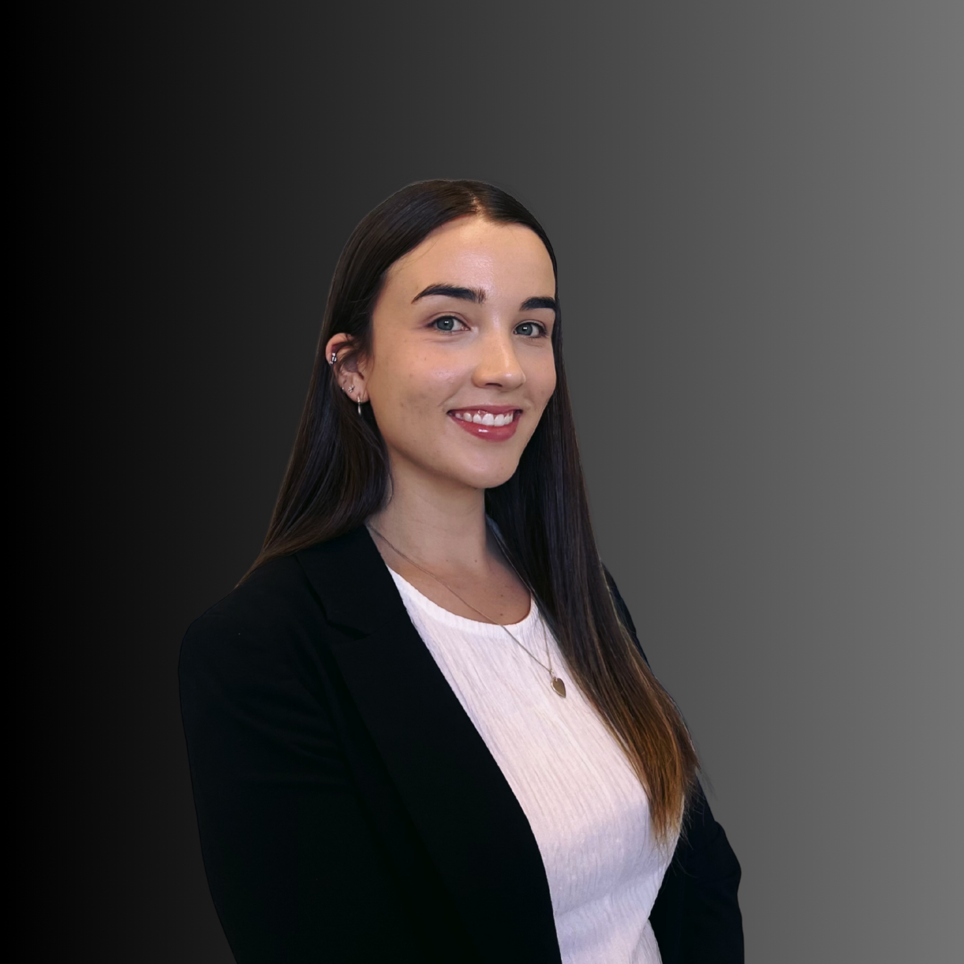 There is a pond in the middle of a grassy field.